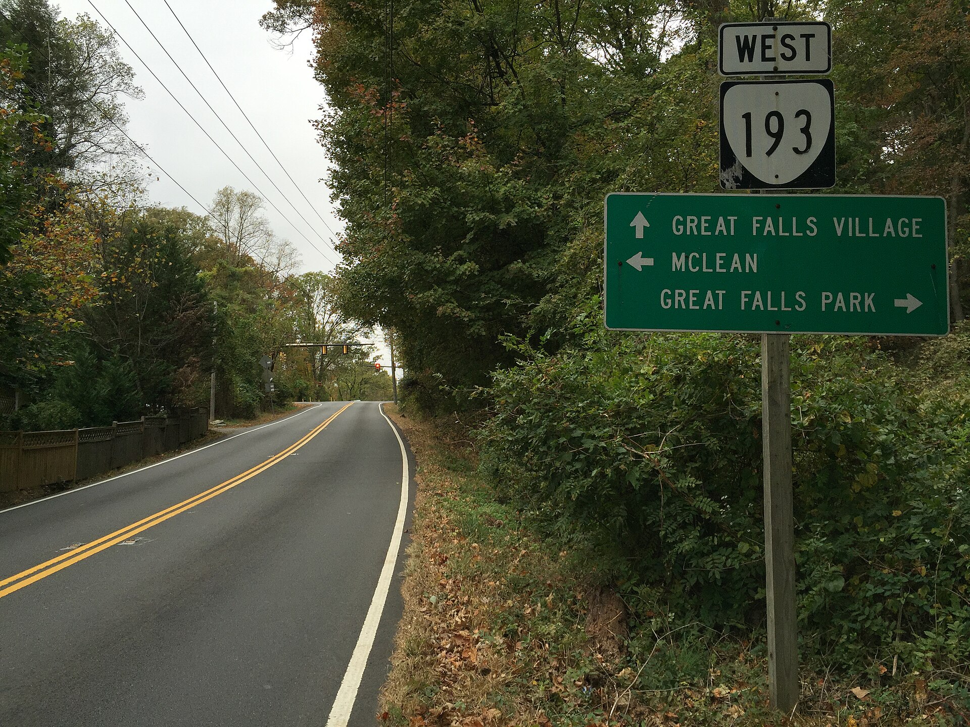 A road sign pointing toward Great Falls Village and McLean near Difficult Run.