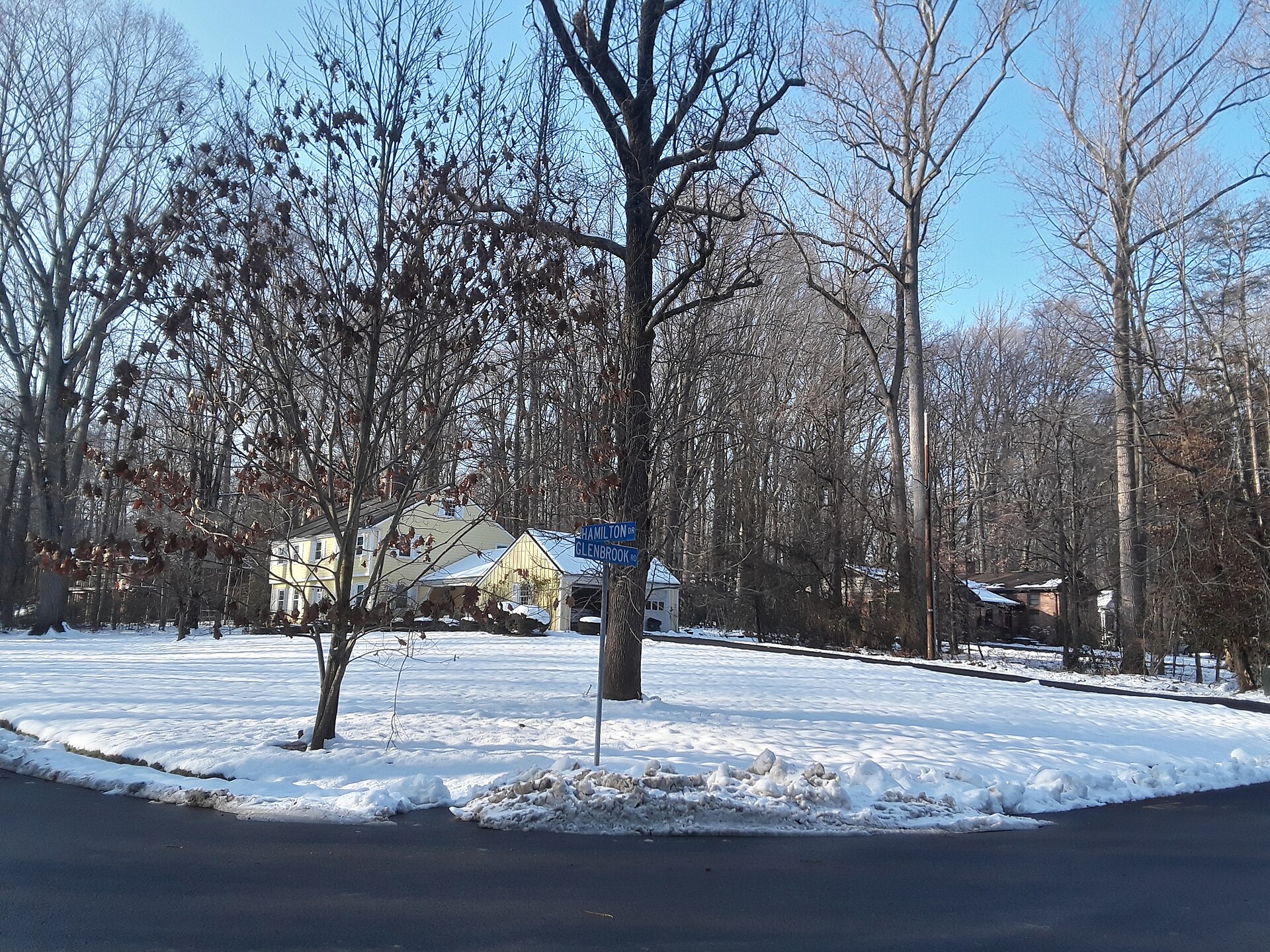 A snow-covered street corner in Mantua, Virginia in winter.