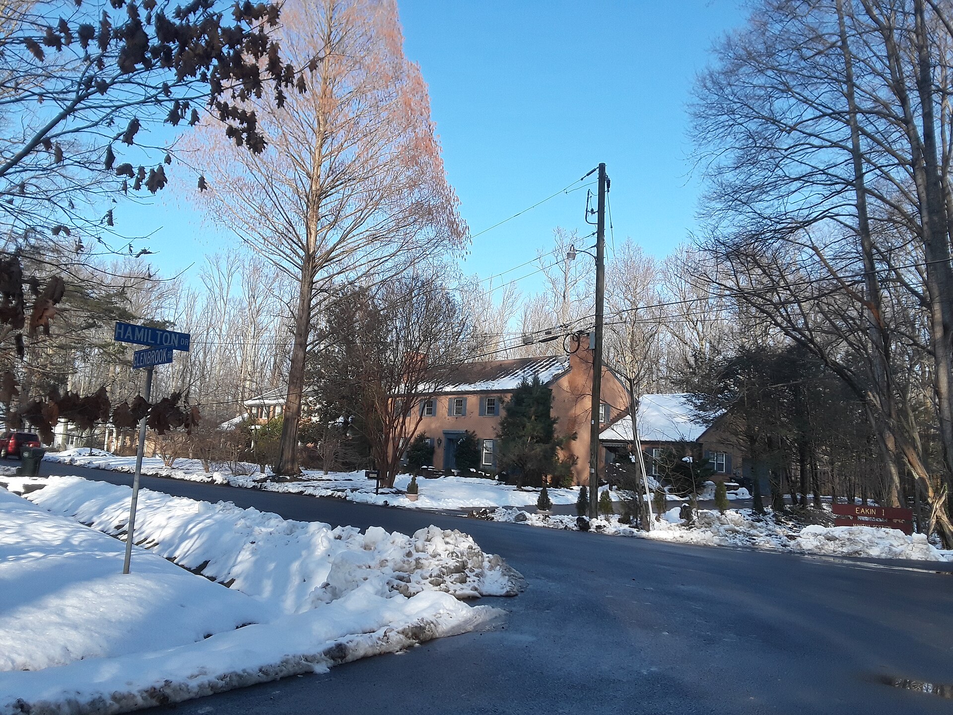 A snow-covered house and street in the Mantua neighborhood.