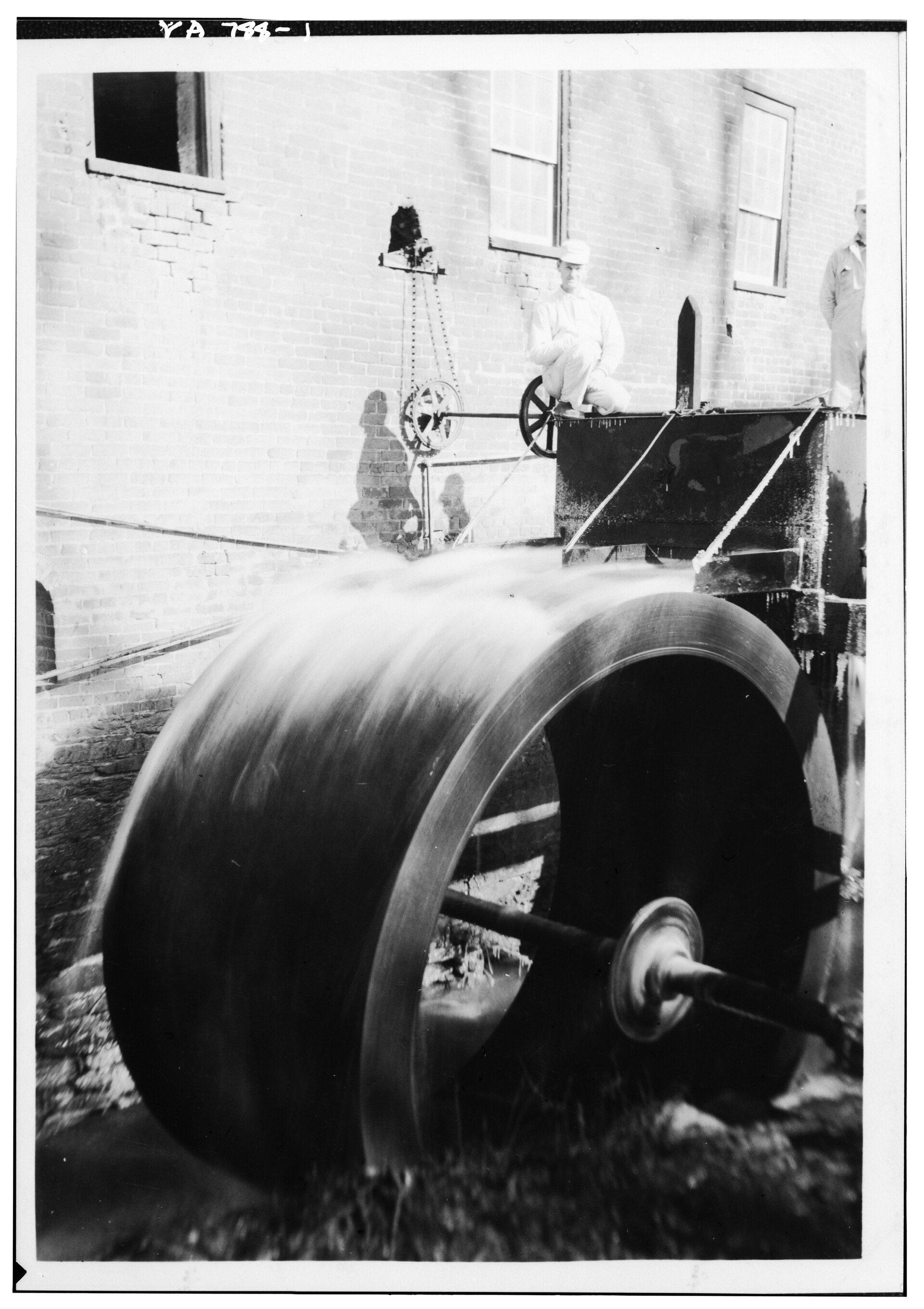 A historic black-and-white view of the Waterford Mill's water wheel on Catoctin Creek.