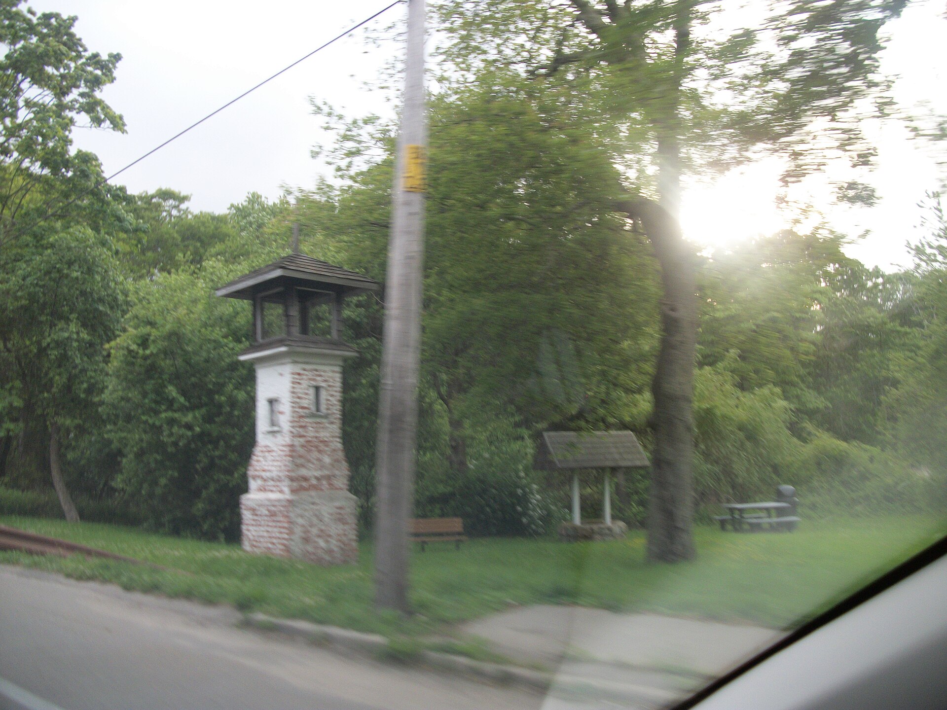 A stone tower monument along the road in Blue Point New York.