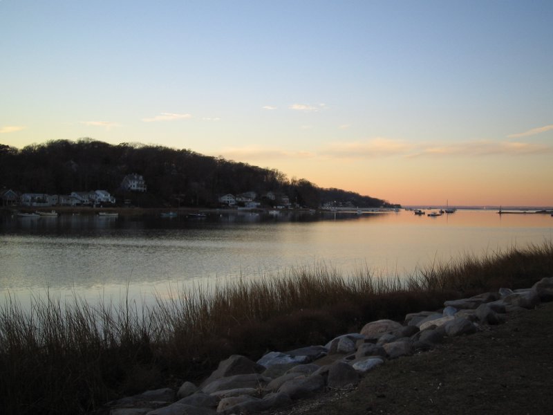 A sunset over the harbor in Centerport New York.