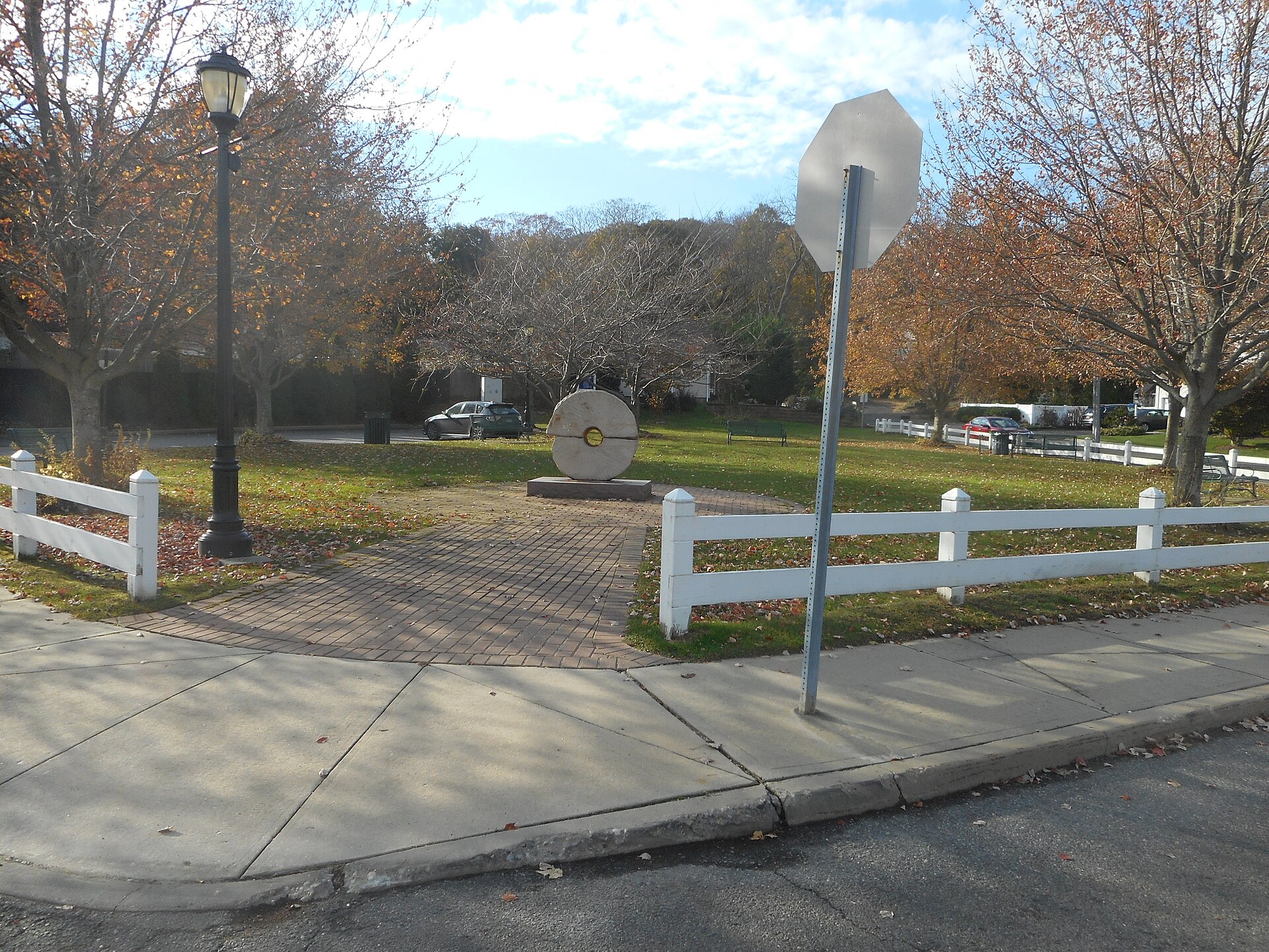 A park with a monument near the water in Centerport New York.