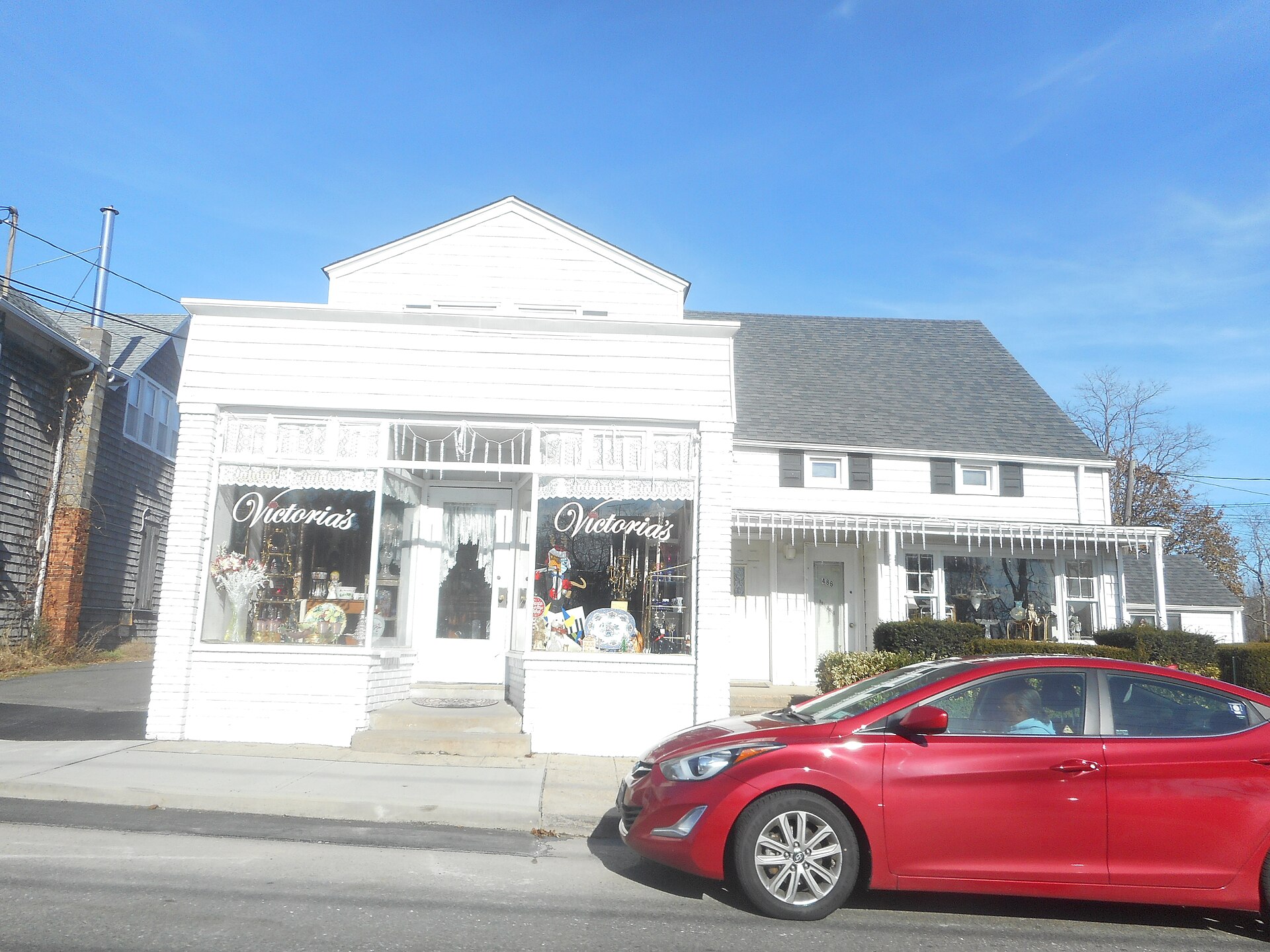 The Victoria's Antiques storefront on Main Street in Eastport, New York.