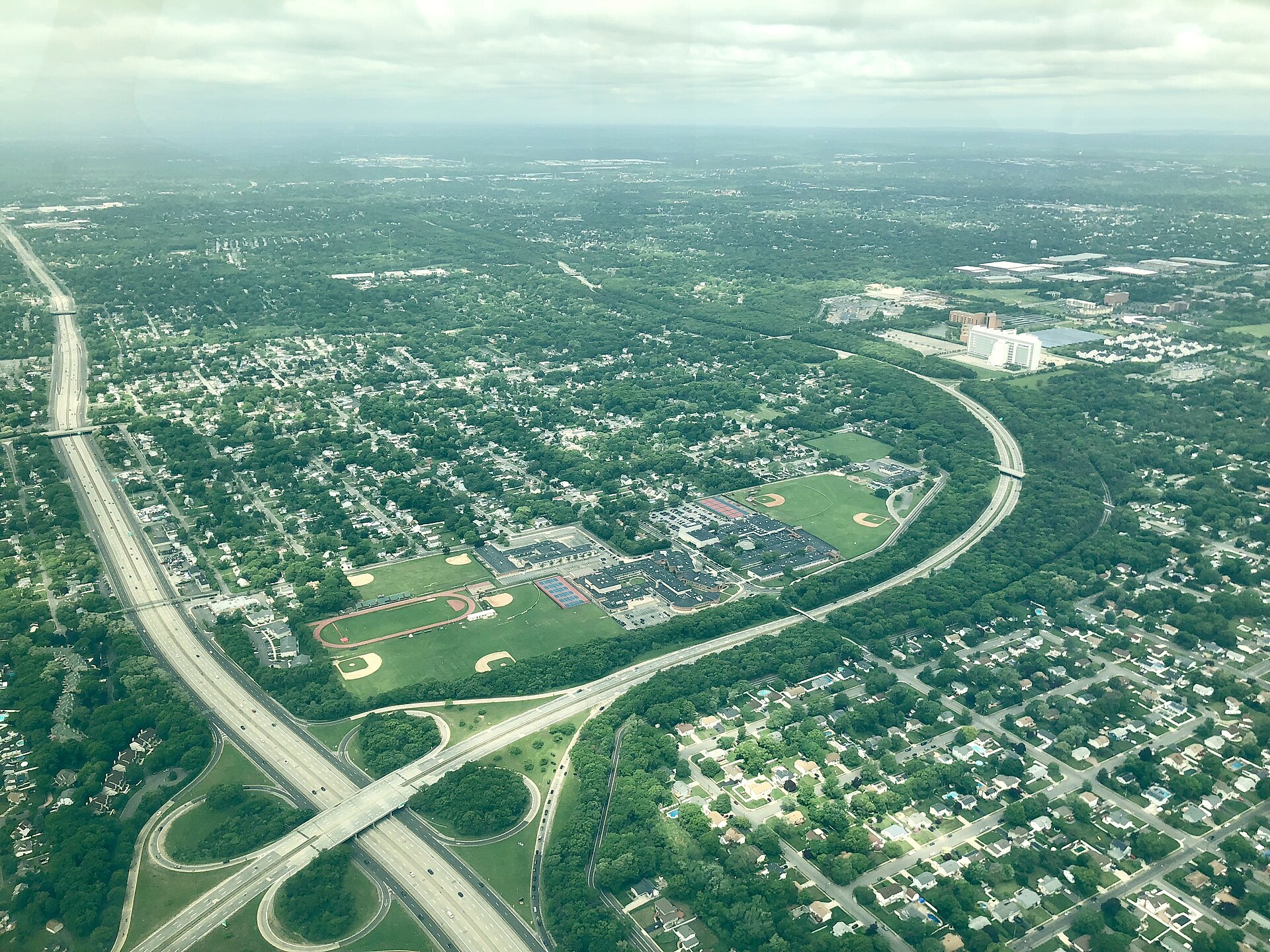 Aerial view of Islip Terrace, New York, with its school campus and highway interchange