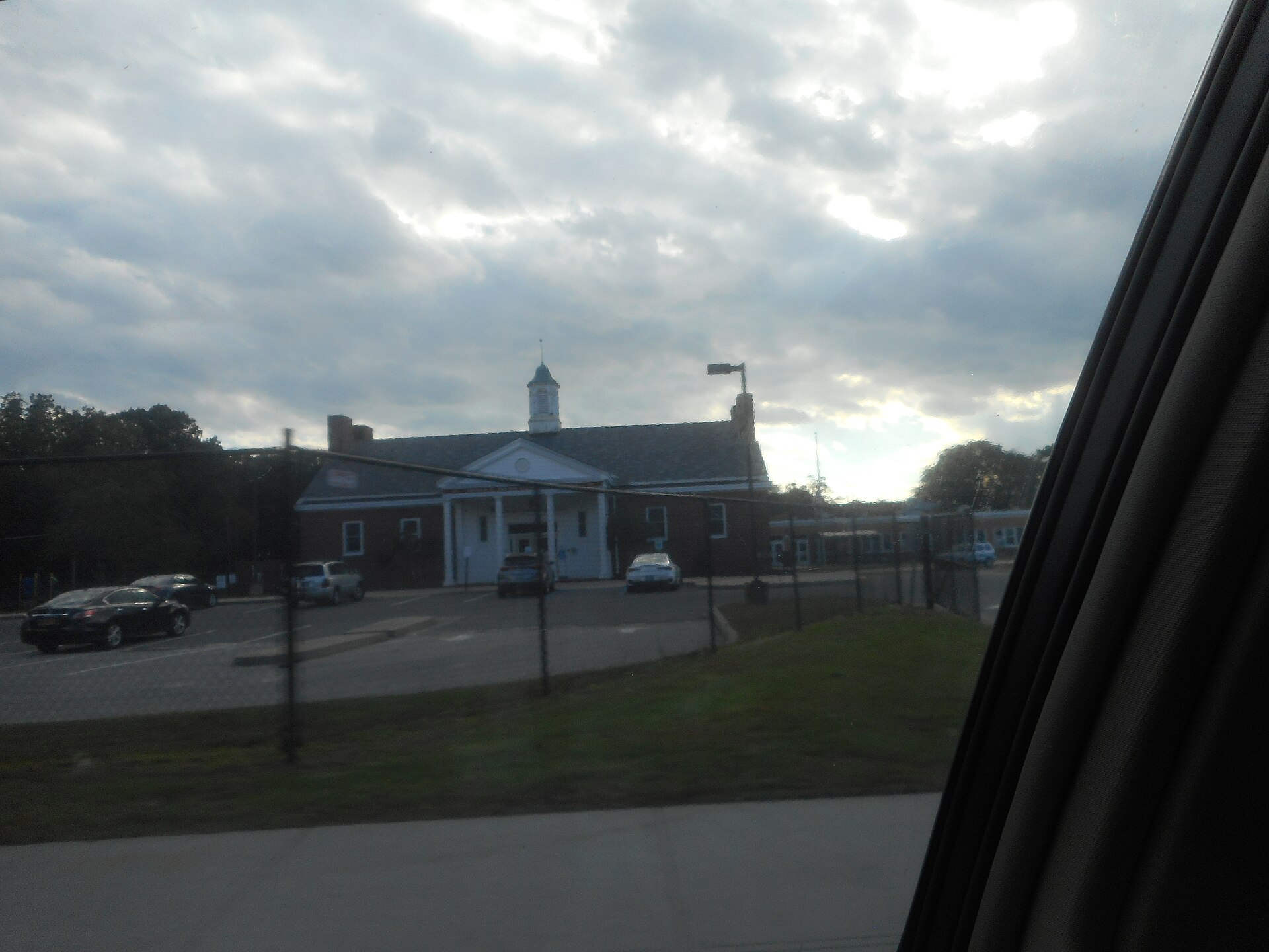 A brick school building, the Arthur E. Premm Learning Center, on Montauk Highway in Oakdale, New York.