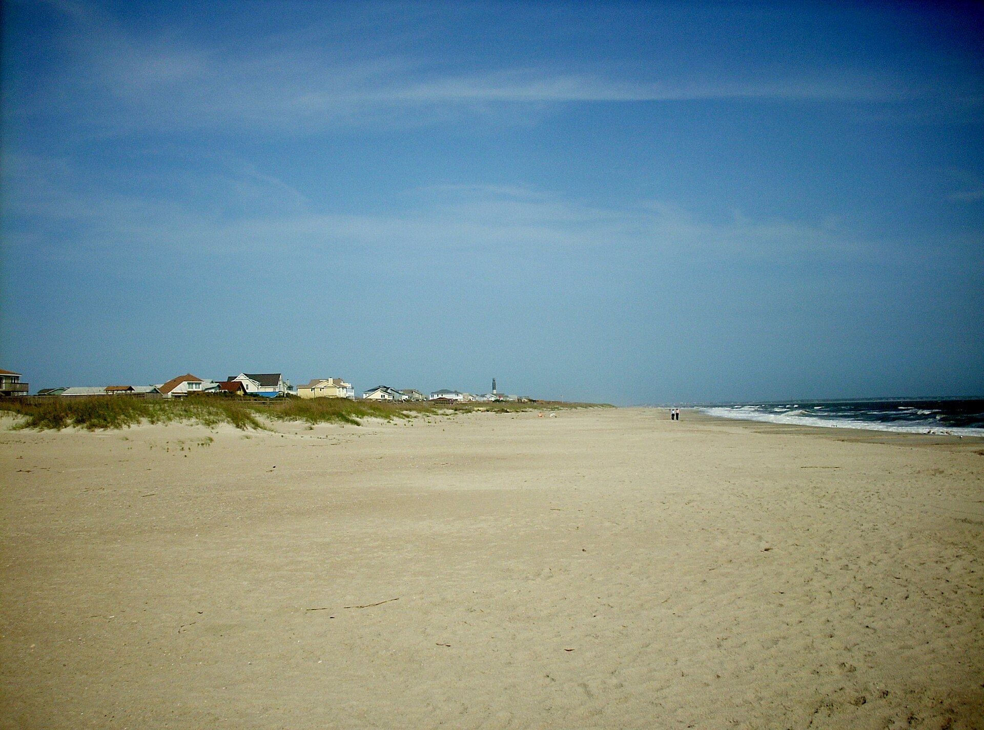 A wide view of Caswell Beach with shoreline homes