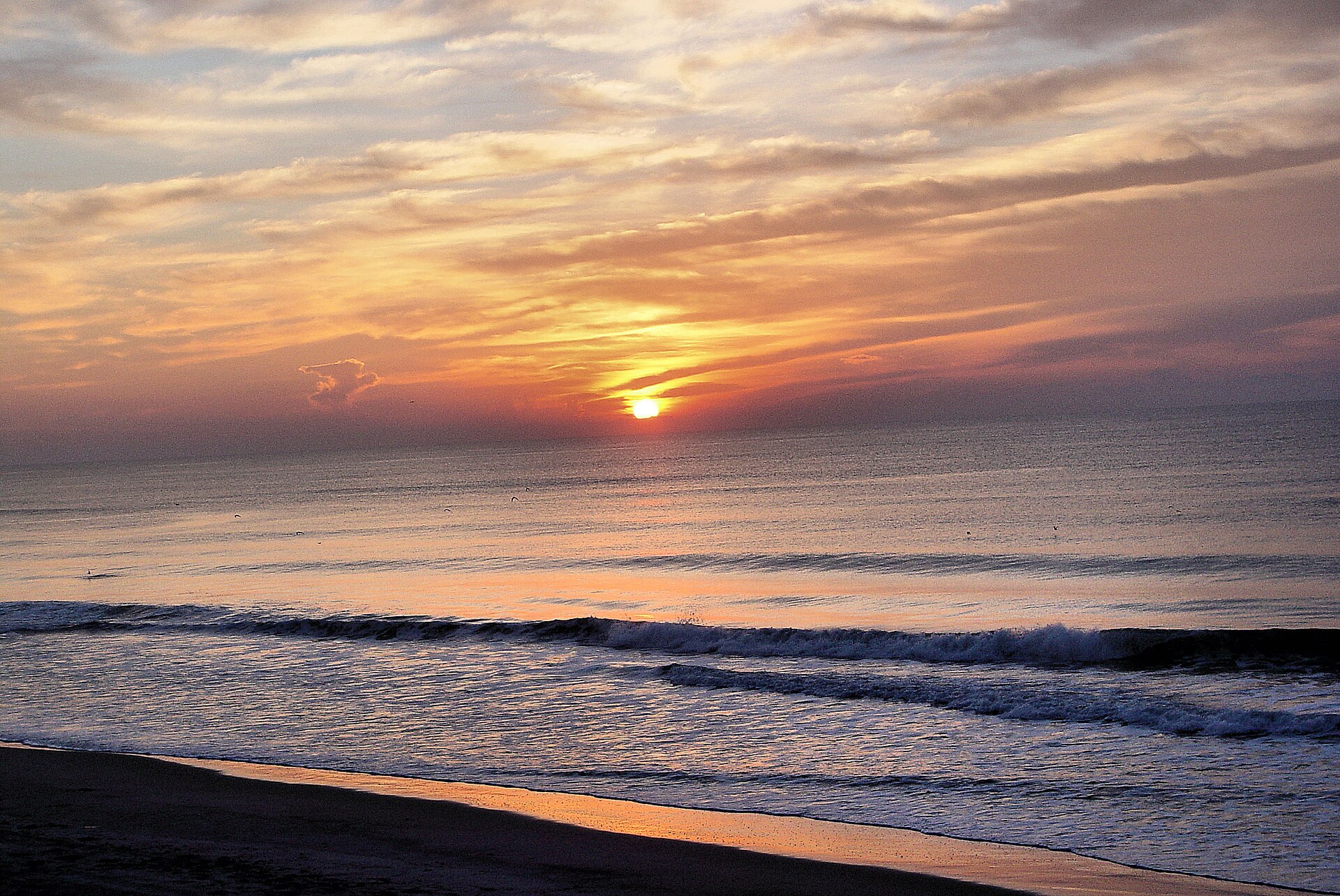 The sun rising over the ocean at North Topsail Beach, North Carolina.