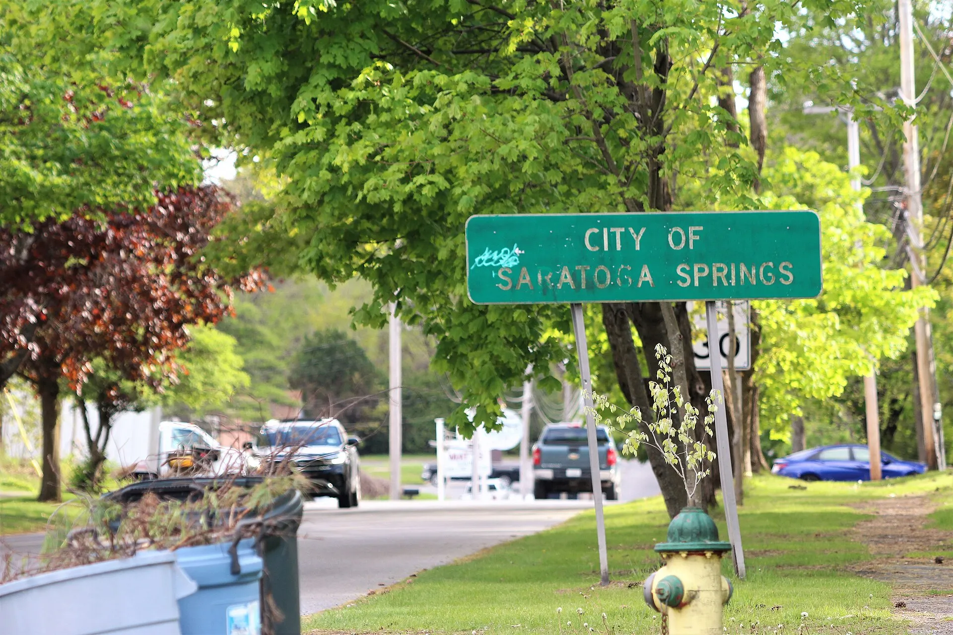 Welcome sign for the city of Saratoga Springs on Maple Avenue, seen from the town of Greenfield