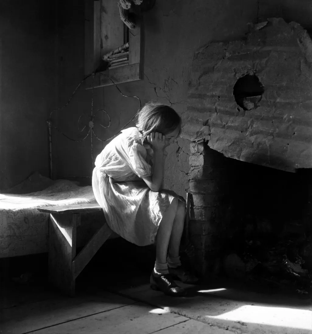 Resettled farm child from Taos Junction to Bosque Farms project. New Mexico. Photograph for the Farm Security Administration, December 1935.