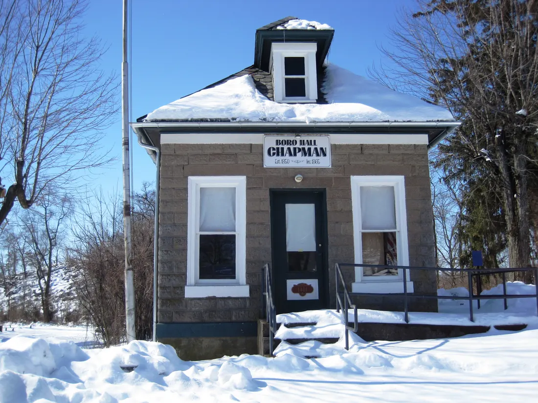 Photo of the Chapman borough hall. Photo taken from Main Street looking west.
