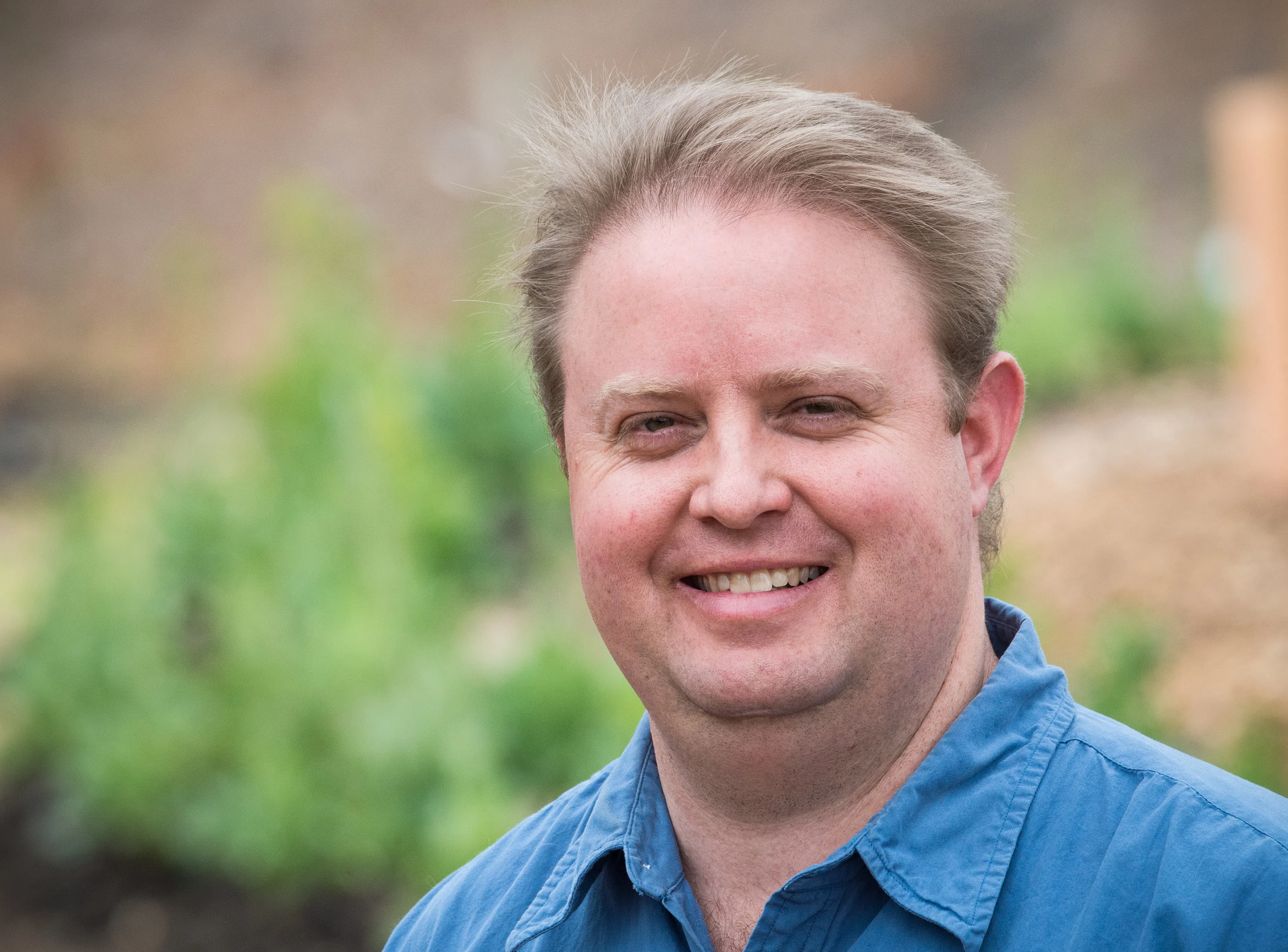 Environmental Horticulture Program Director Aaron Poulsen highlights the terraced rows and vertical gardens and many other features of the -Gwinnett Technical College Learning Garden in Lawrenceville GA on (20150320-OSEC-LSC-0622)