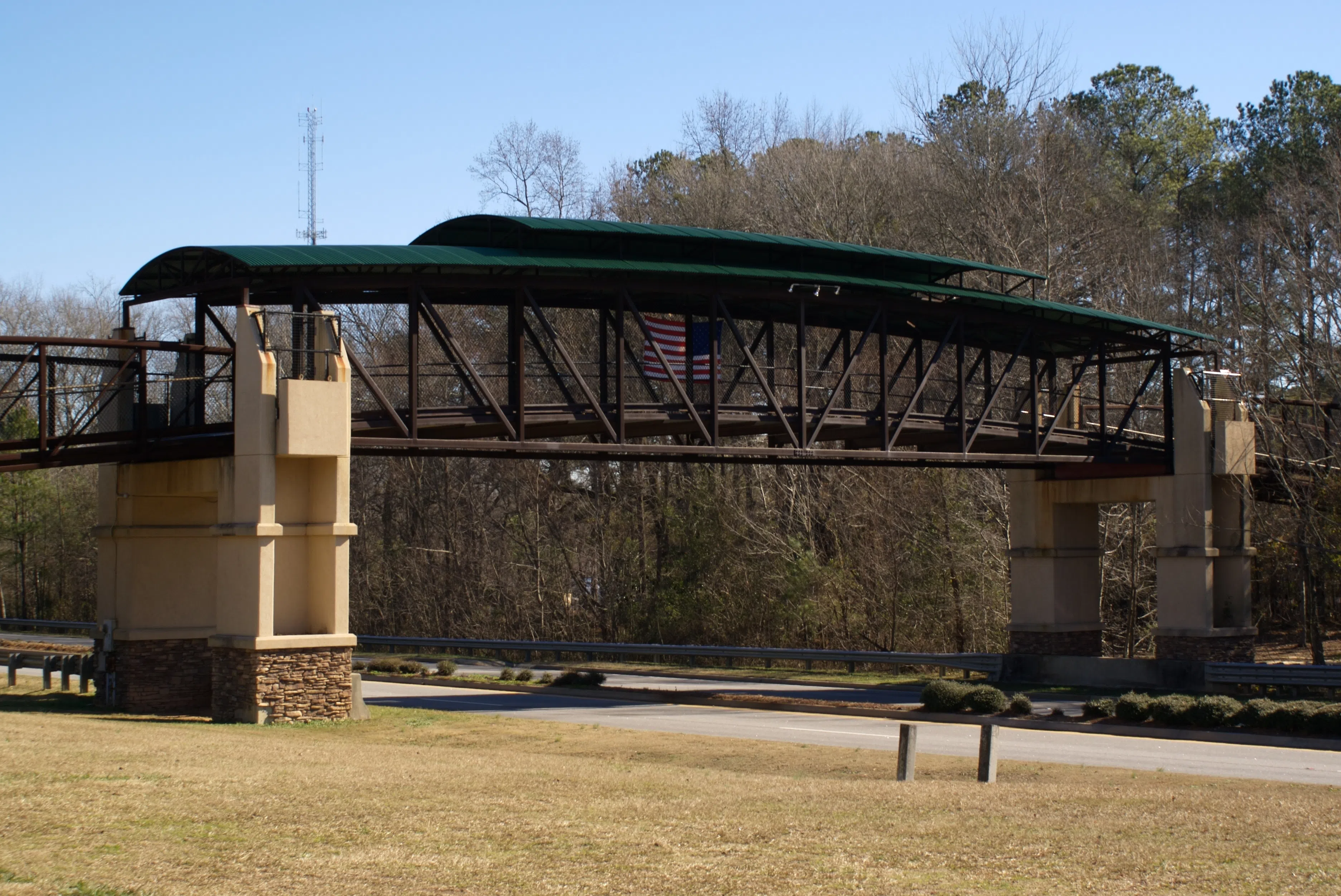 This is a Golf Cart bridge in Peachtree City , Georgia, United States that passes over Georgia State Route 54 . — License: