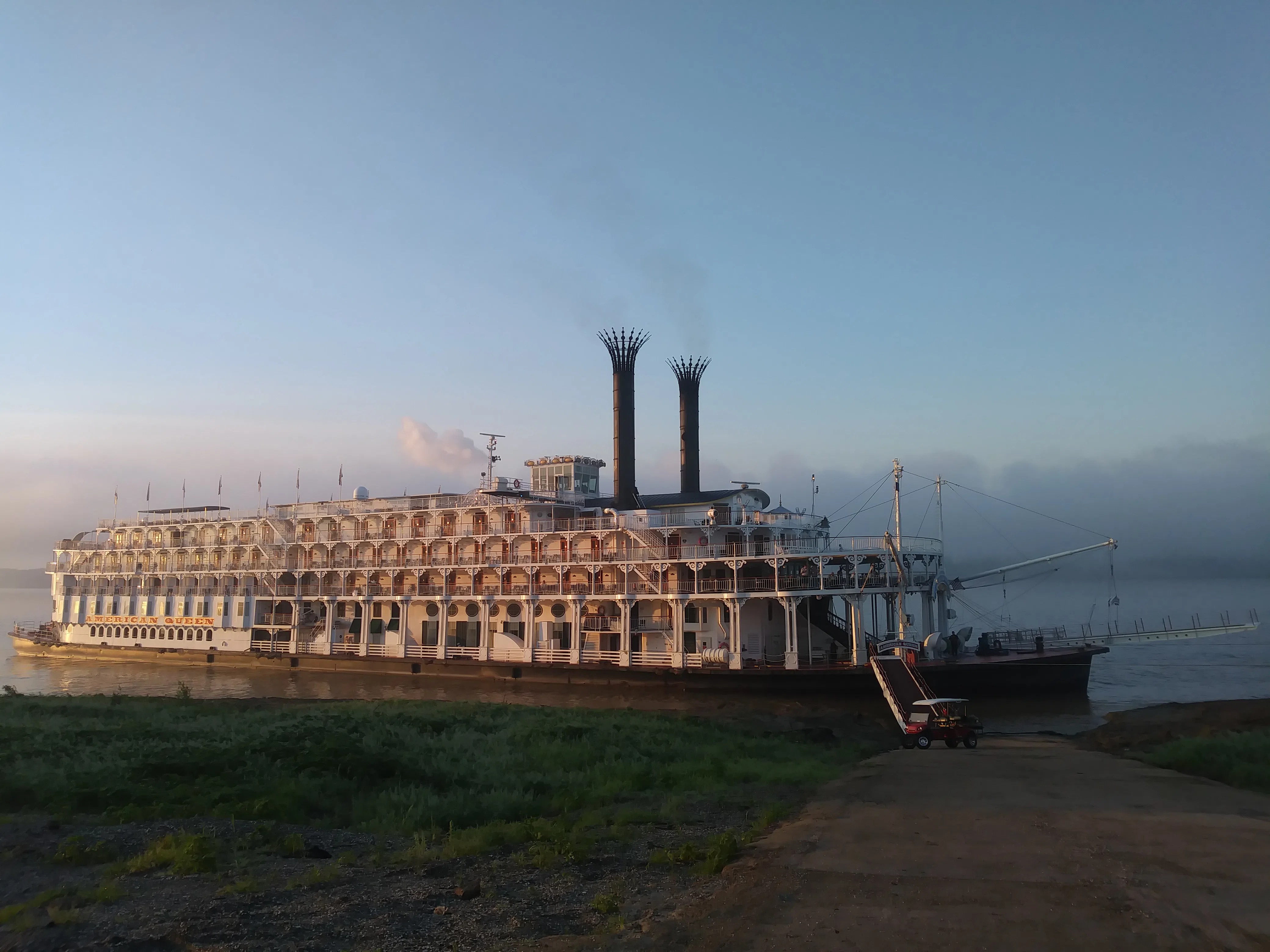 American Queen steamboat docked at a boat ramp in St. Francisville, Louisiana on September 1, 2017. Pictured in morning time with