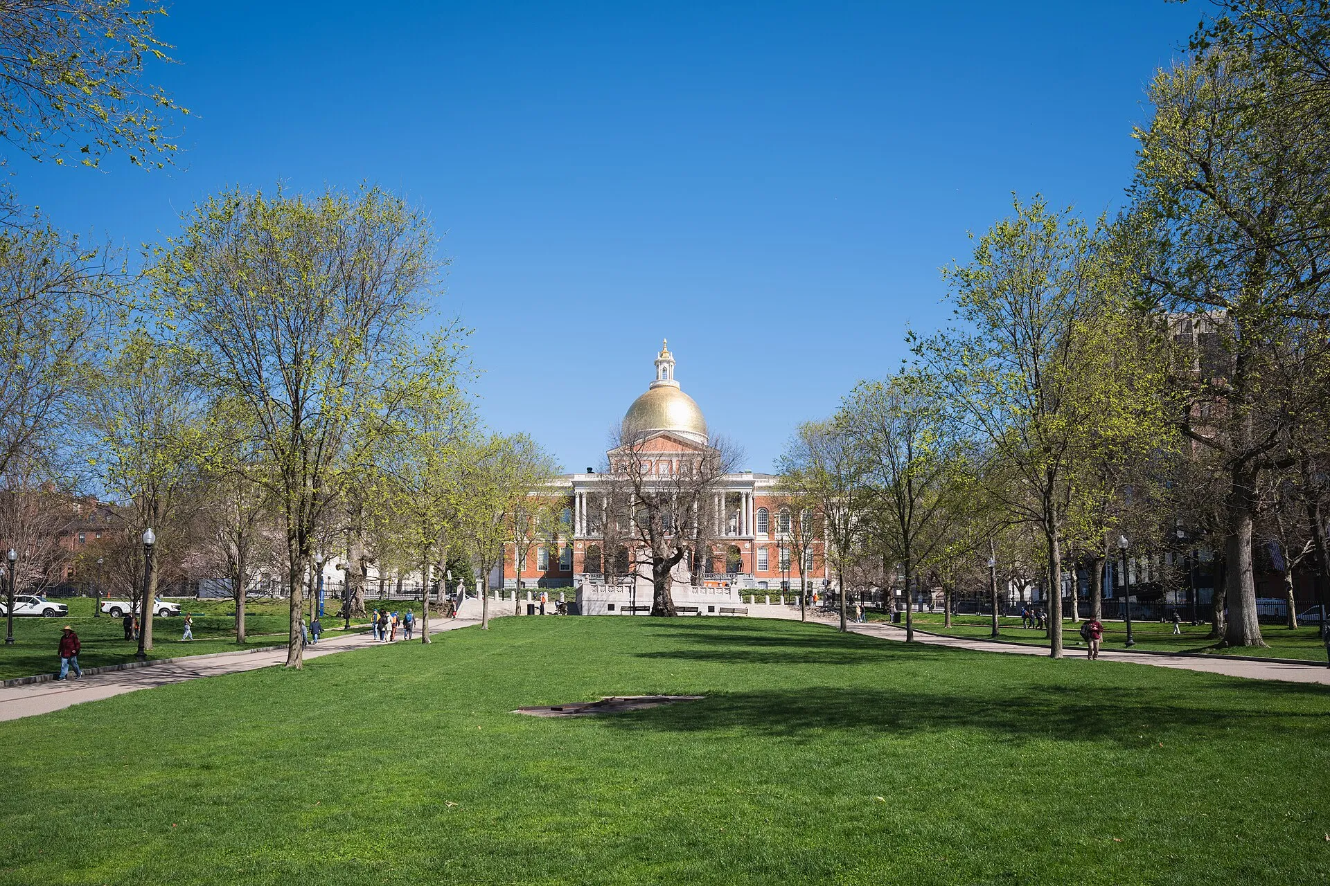 The Massachusetts State House (Charles Bulfinch, 1798) and its golden dome, seen from the lawn of Boston Common, Boston, Massachusetts.