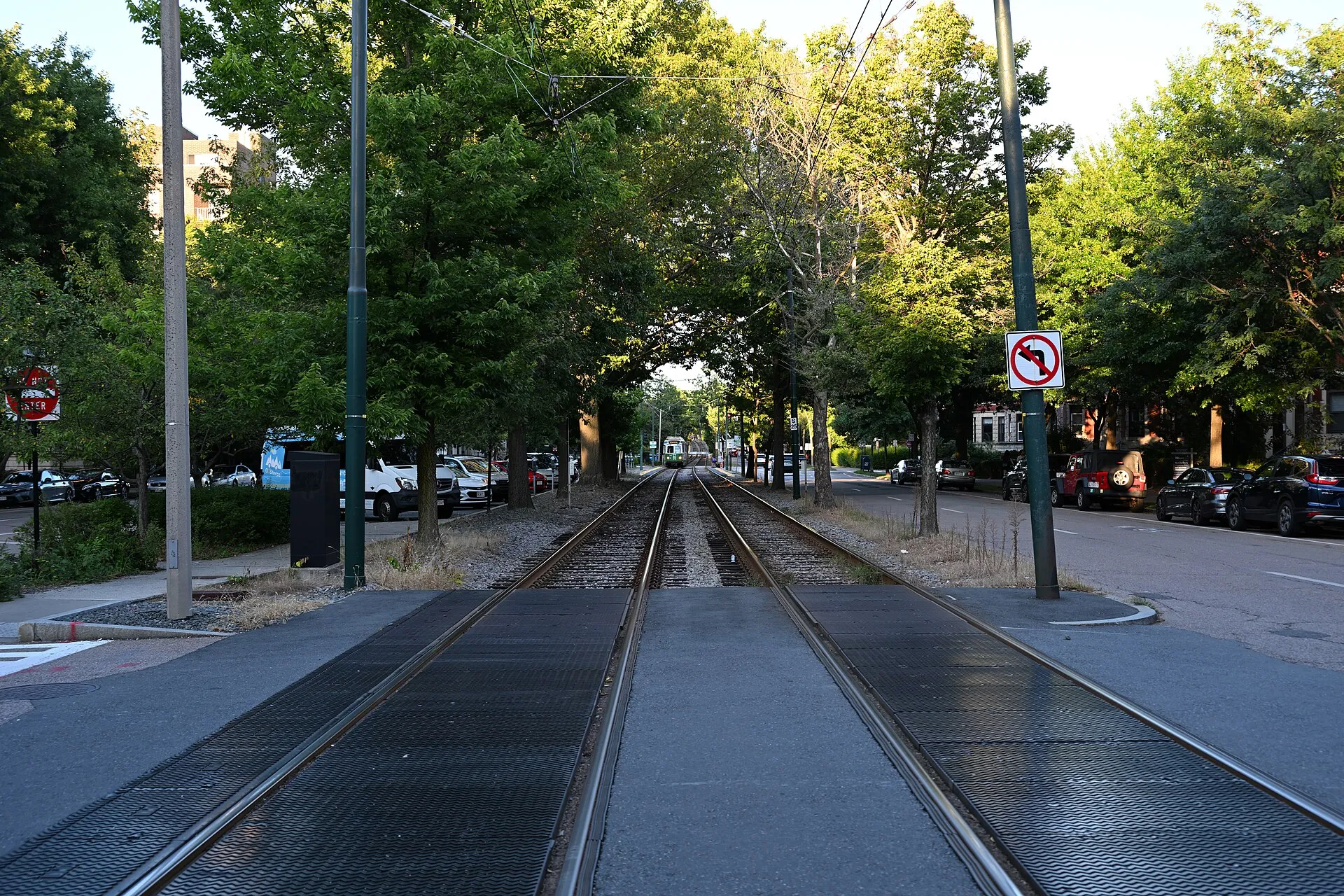 An outbound Green Line C branch train approaches the intersection with Strathmore Road.