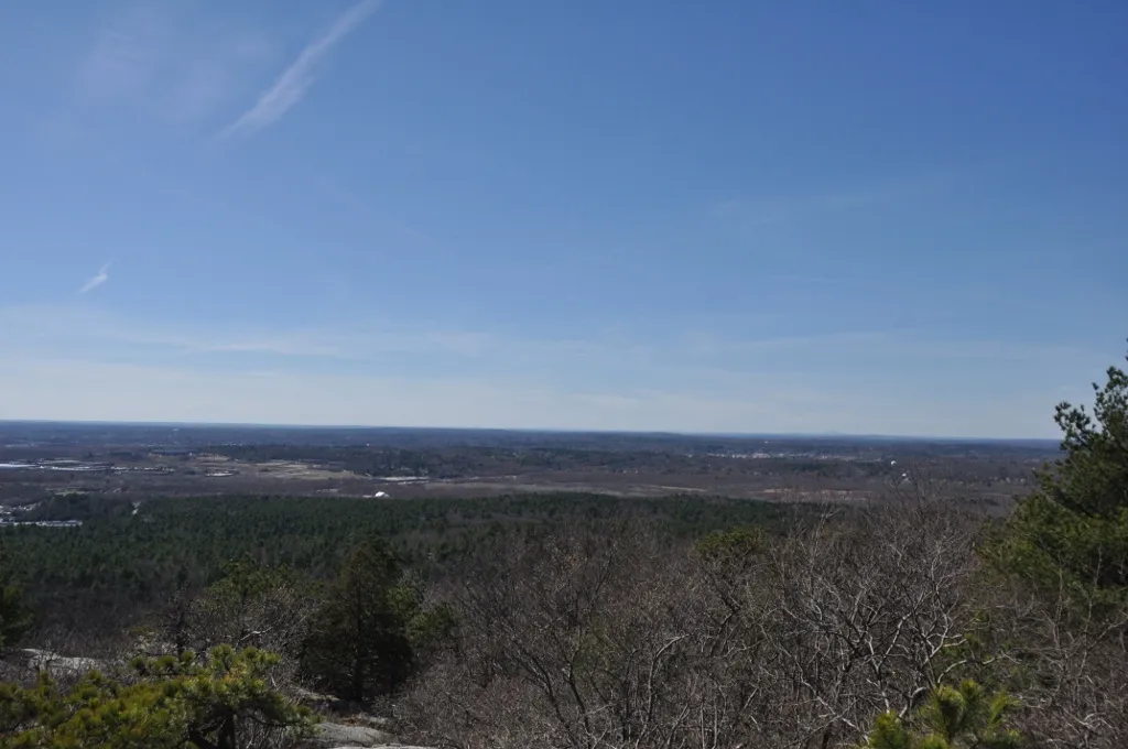 View of Little Blue Hill from Great Blue Hill in the Blue Hills Reservation in Canton, Massachusetts. Beyond Little Blue Hill (but not readily discernible) is the Neponset River. This area is the general location of the prehistoric Green Hill Site.