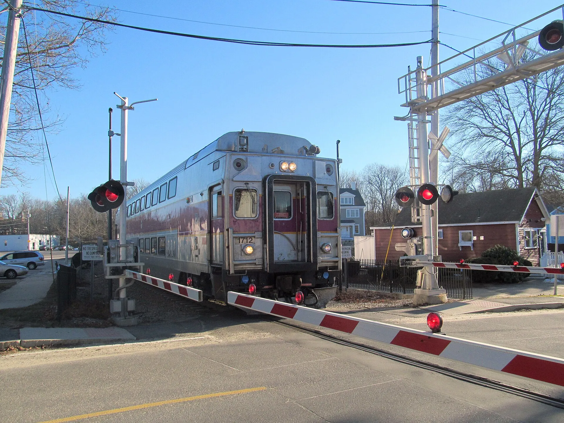 An inbound Greenbush Line train crosses Pleasant Street in downtown Cohasset in January 2017
