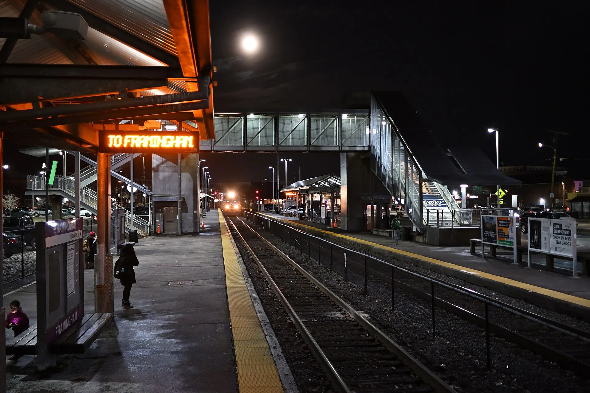 An outbound Framingham/Worcester Line train entering Framingham station in January 2024