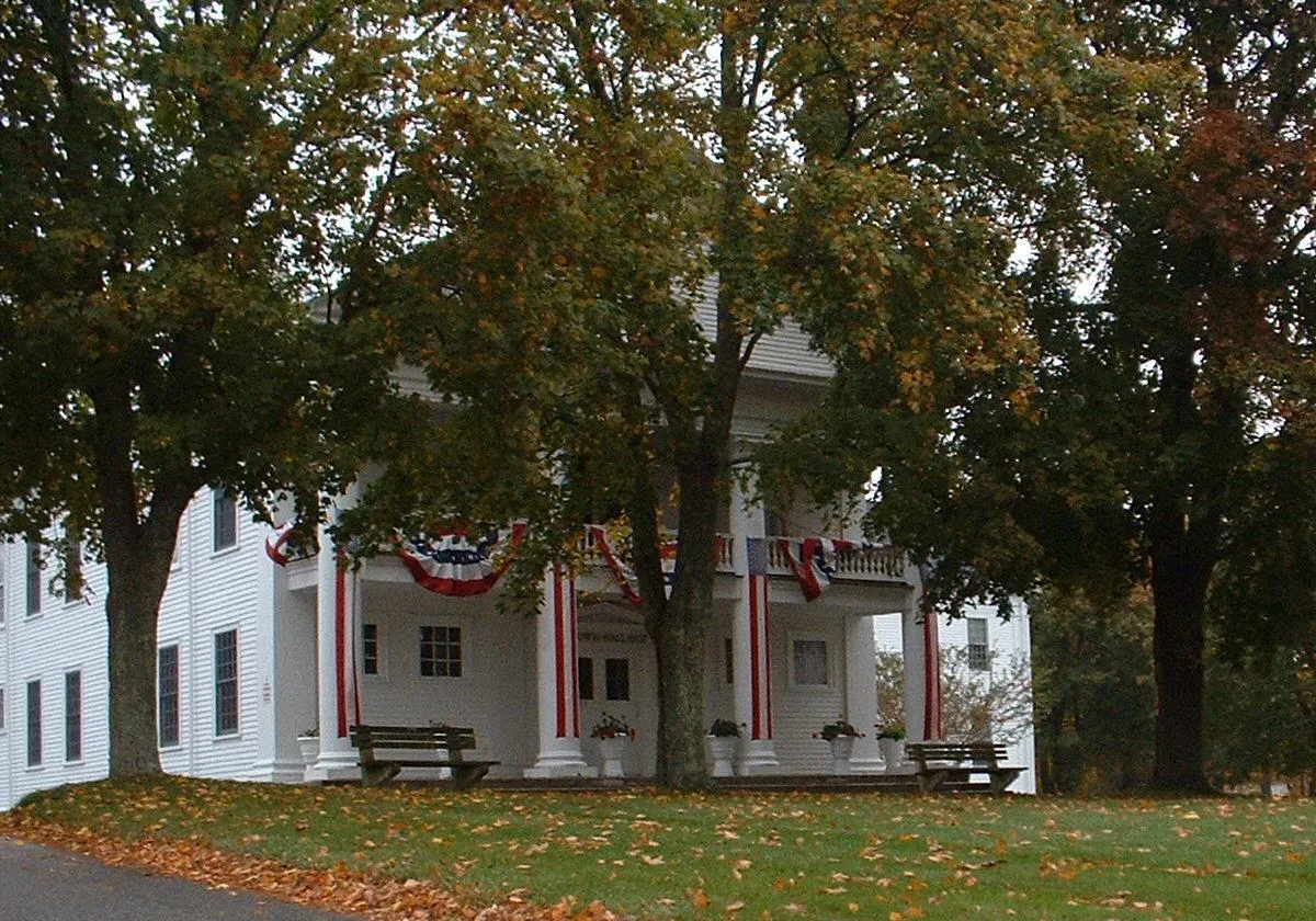 Halifax Town Hall, Halifax, Massachusetts, surrounded by a grove of trees.