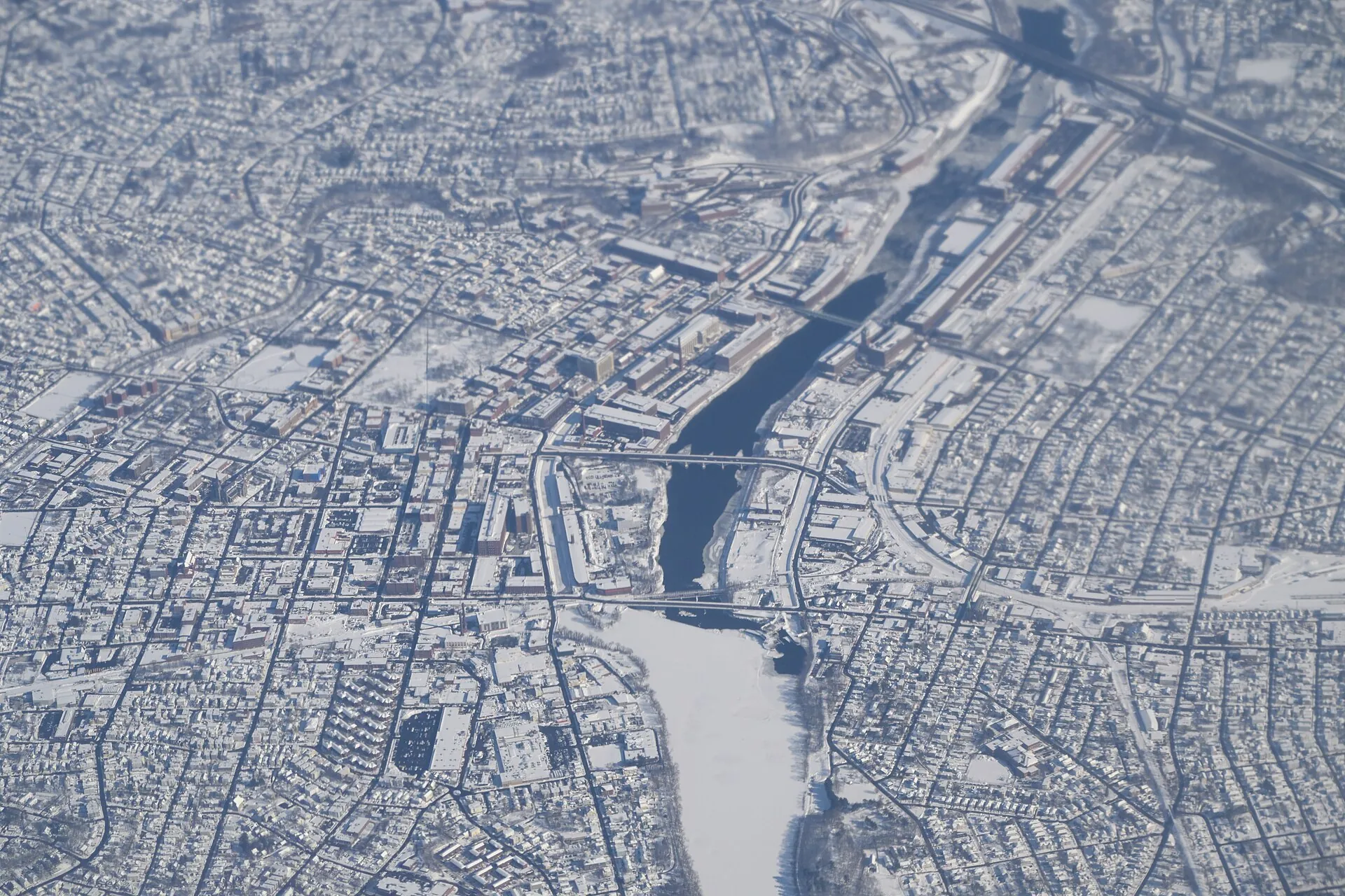Lawrence, Massachusetts, as seen from United Airlines flight 2279 from Boston to San Francisco. Unfortunately the upper part of the image is blurry due to jet engine exhaust.