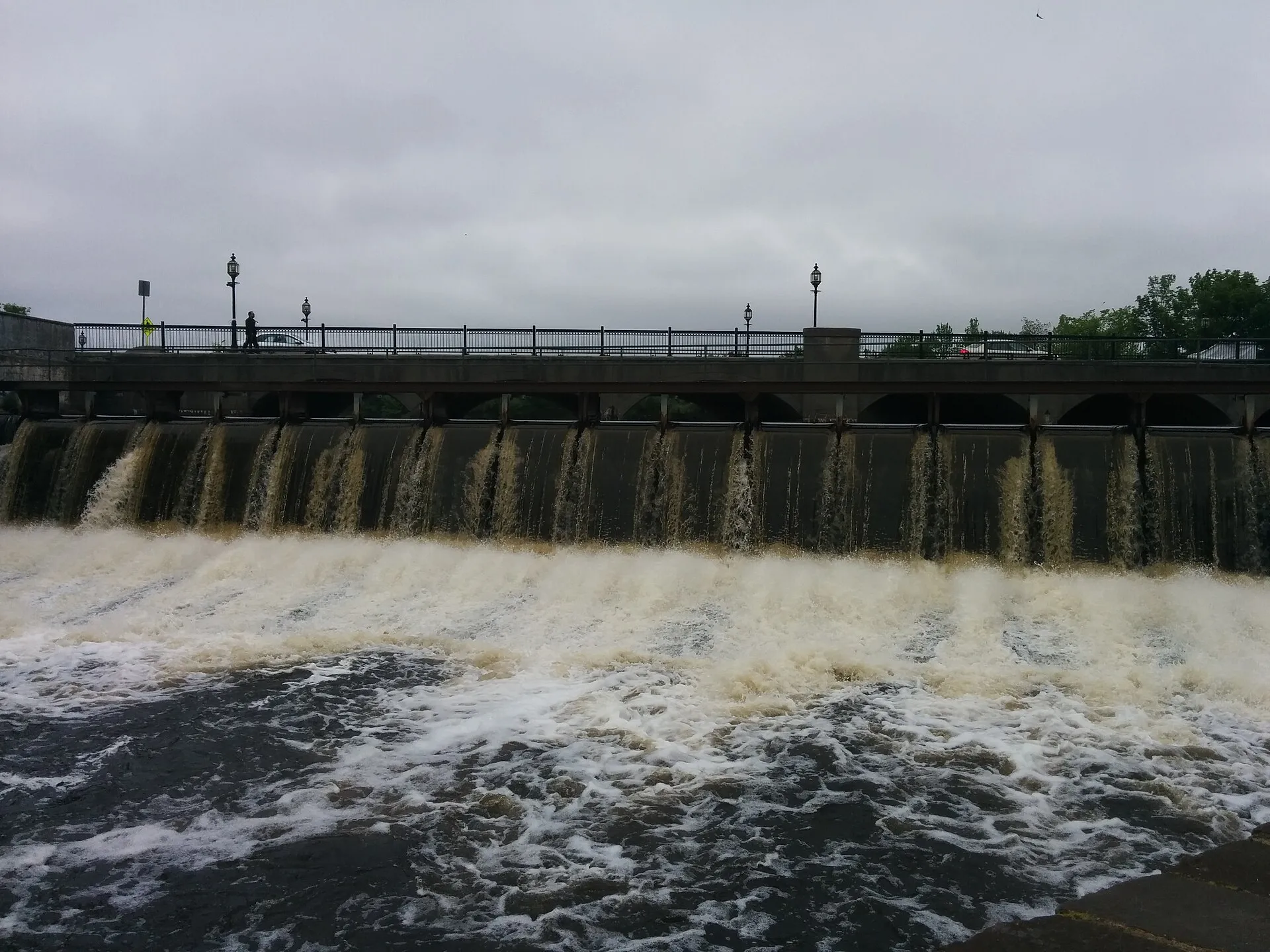 The Moody Street Dam on the Charles River in Waltham, Massachusetts.  The Moody Street Bridge is behind the dam in the background.