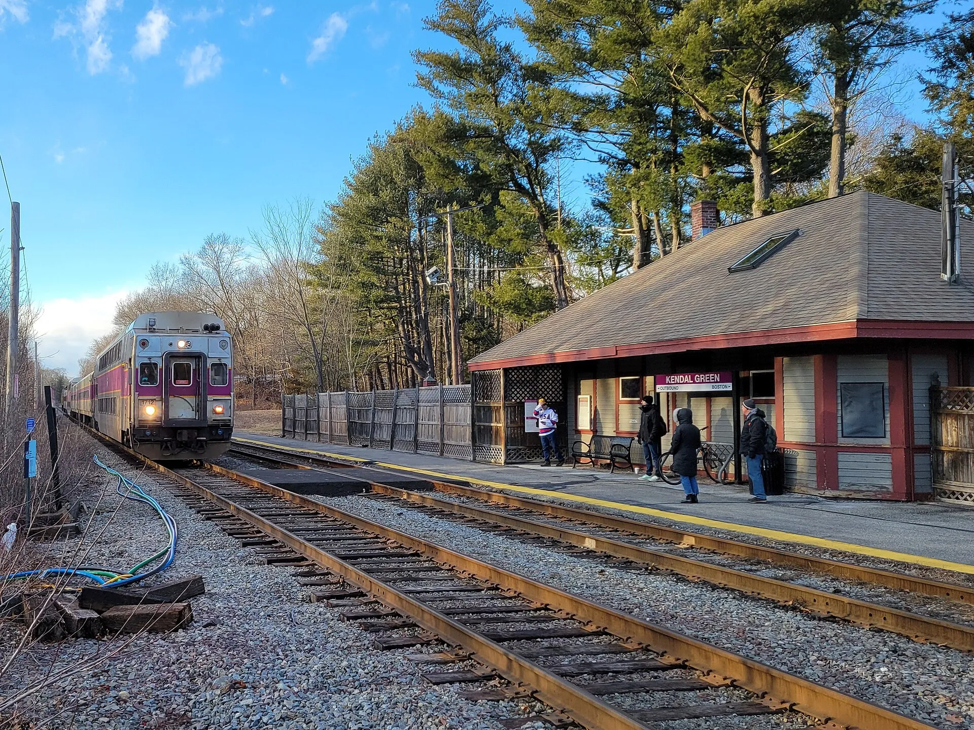 An inbound Fitchburg Line train arriving at Kendal Green station, Weston, Massachusetts, in February 2024.