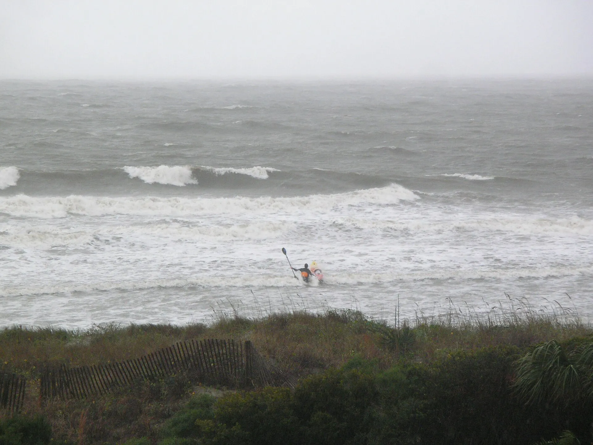 A surfer on the Atlantic Ocean near the Isle of Palms.