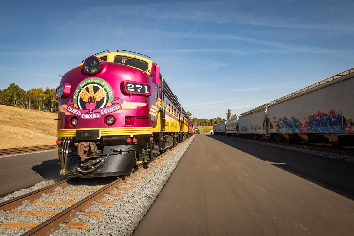 Aberdeen, Carolina and Western Railway 's EMD F9A diesel locomotive 271 with F9B 276 behind at Midland Logistics Park in Midland, North Carolina on October 11, 2022.