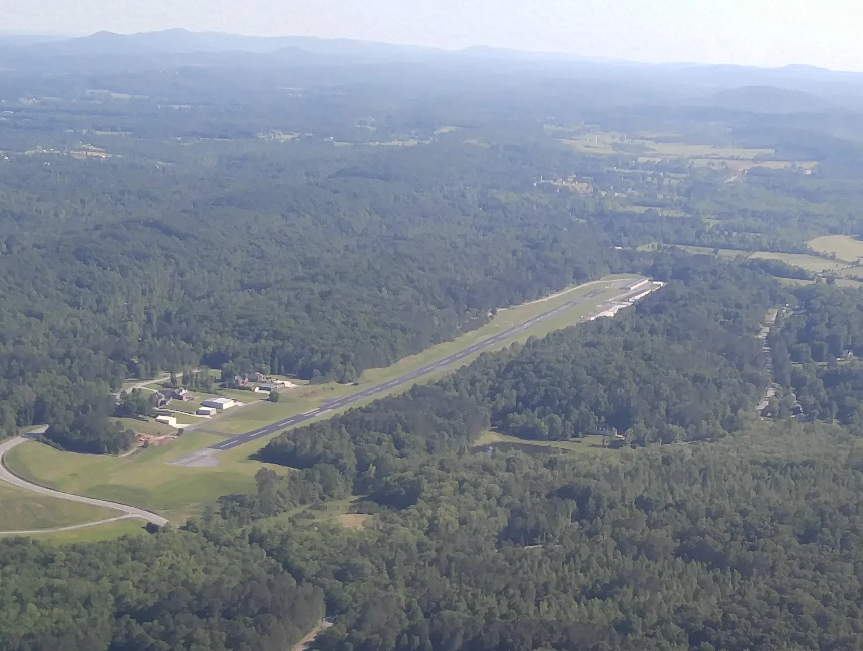 Collegedale TN airport (KFGU) from the downwind leg of runway 3, looking at the end of runway 21. — License: