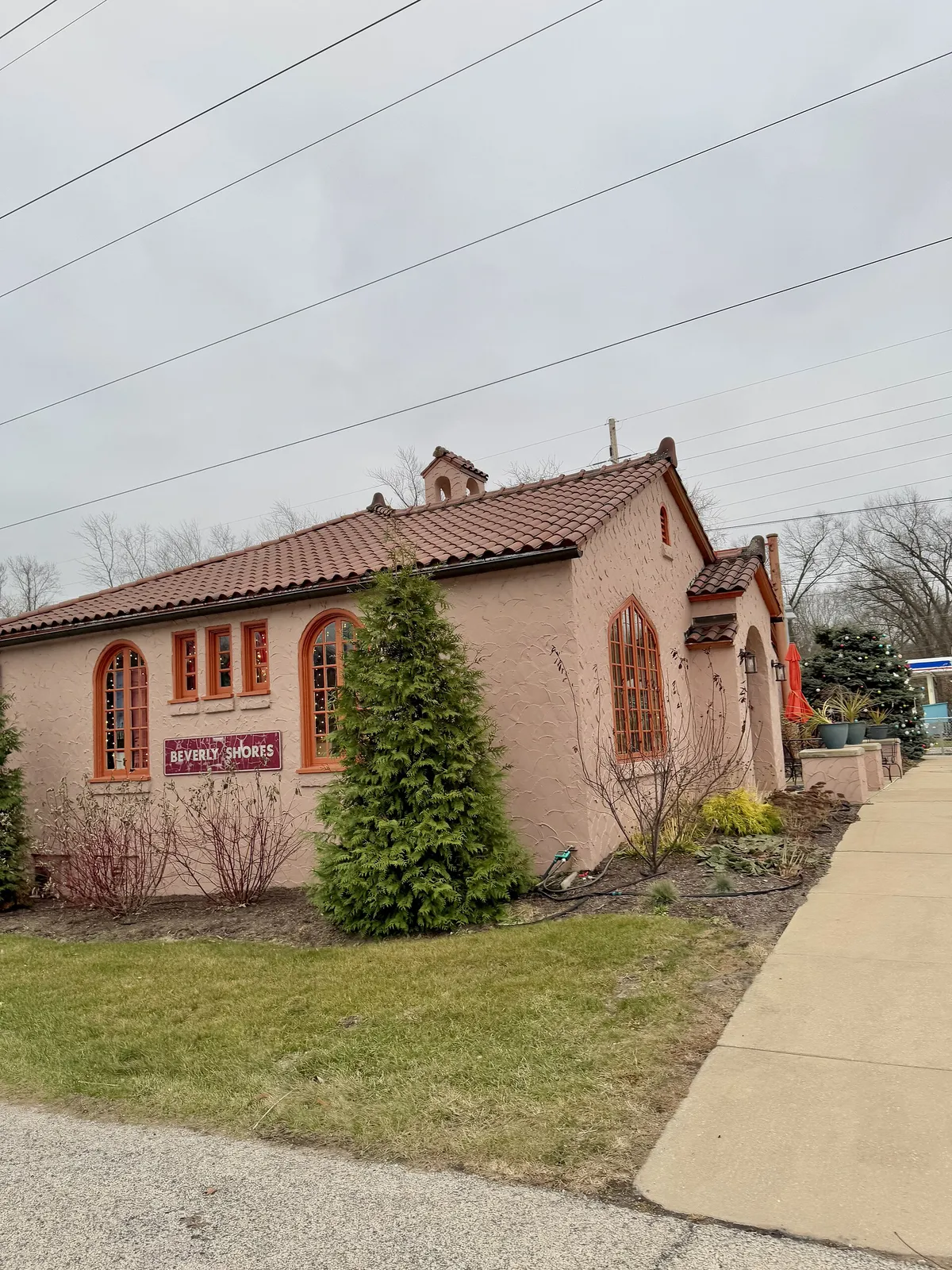 Built in 1929, this Spanish Colonial Revival-style building was designed by Arthur Gerber to serve as a passenger station on the South Shore Line for the town of Beverly Shores, Indiana, a resort community located southeast of Chicago along Lake Michigan. The building features a stucco-clad exterior