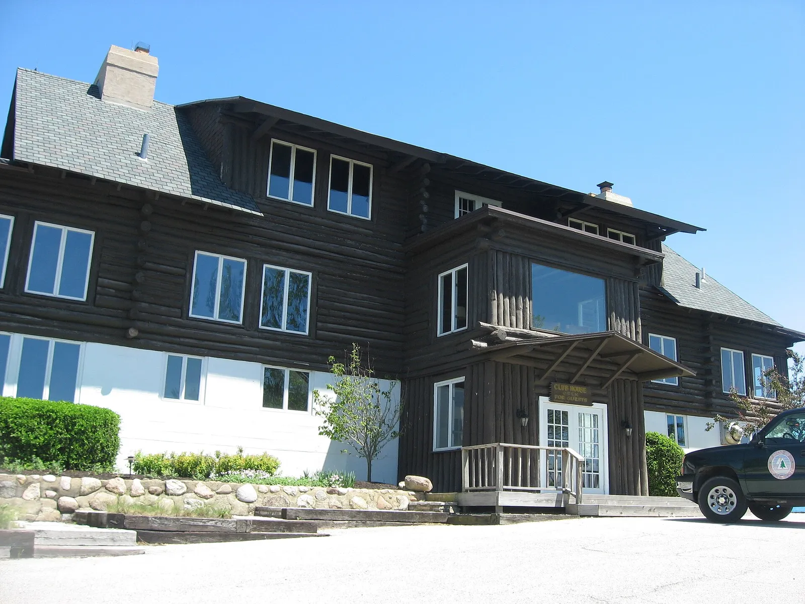 Front of the Dune Acres Clubhouse , located at the upper end of Clubhouse Drive in Dune Acres , Indiana , United States . Built in 1925, it is listed on the National Register of Historic Places . No better angle was realistically possible without leaving my car, due to the placement of trees and of