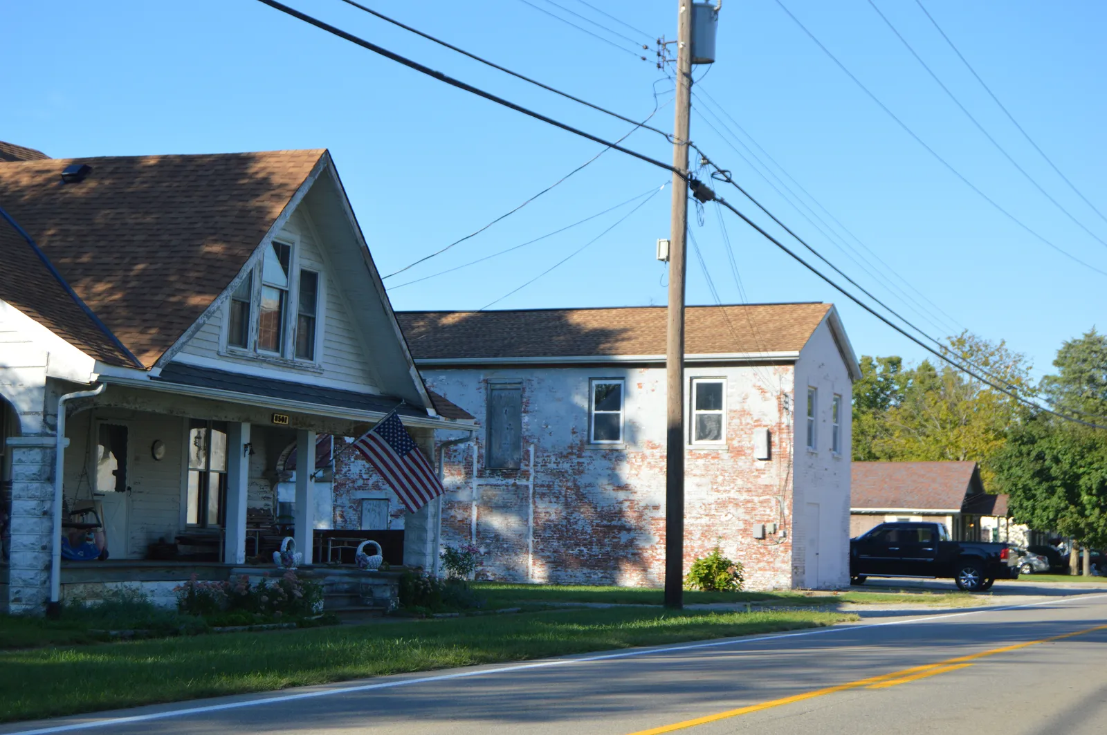 Buildings on the western side of Main Street (State Route 132) near the Third Street intersection in Butlerville, Ohio, United States.
