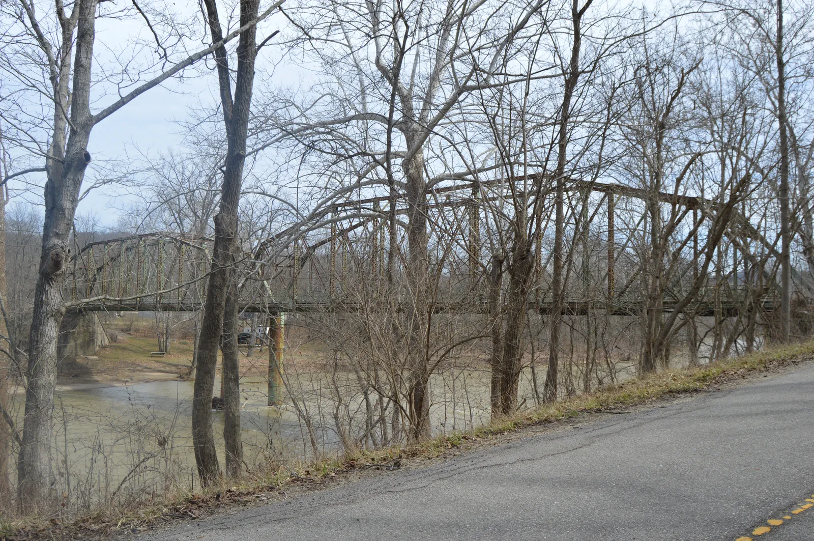 Western (upstream) side of the Cedar Grove Bridge, which before its closure carried State Road 1 over the Whitewater River at Cedar Grove, Indiana, United States. Built in 1914, it is listed on the National Register of H