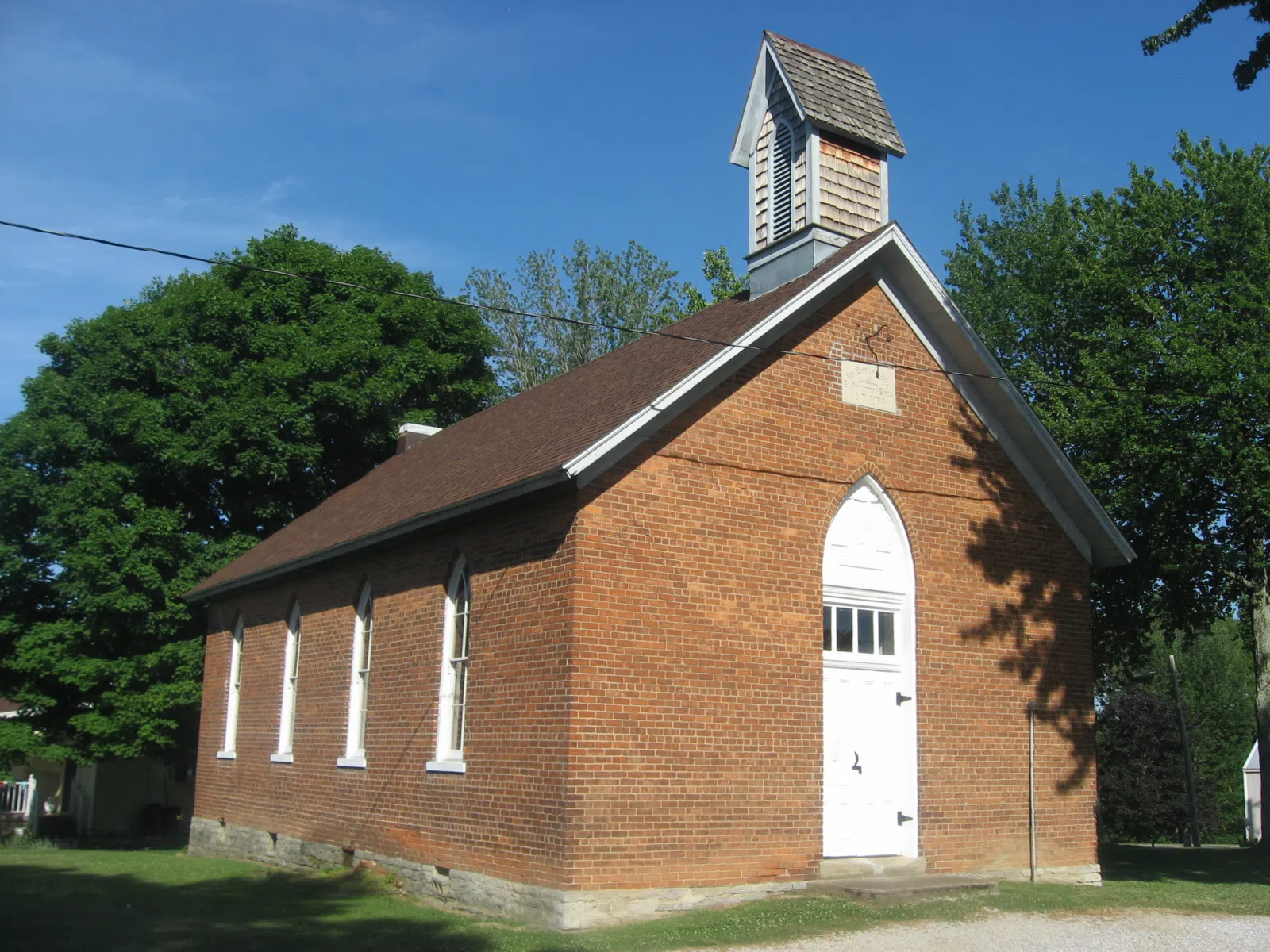 Front and northern side of St. John's Lutheran School, located at 7291 State Road 62 southwest of Dillsboro in Caesar Creek Township, Dearborn County, Indiana, United States. Built in 1888, the school and several related