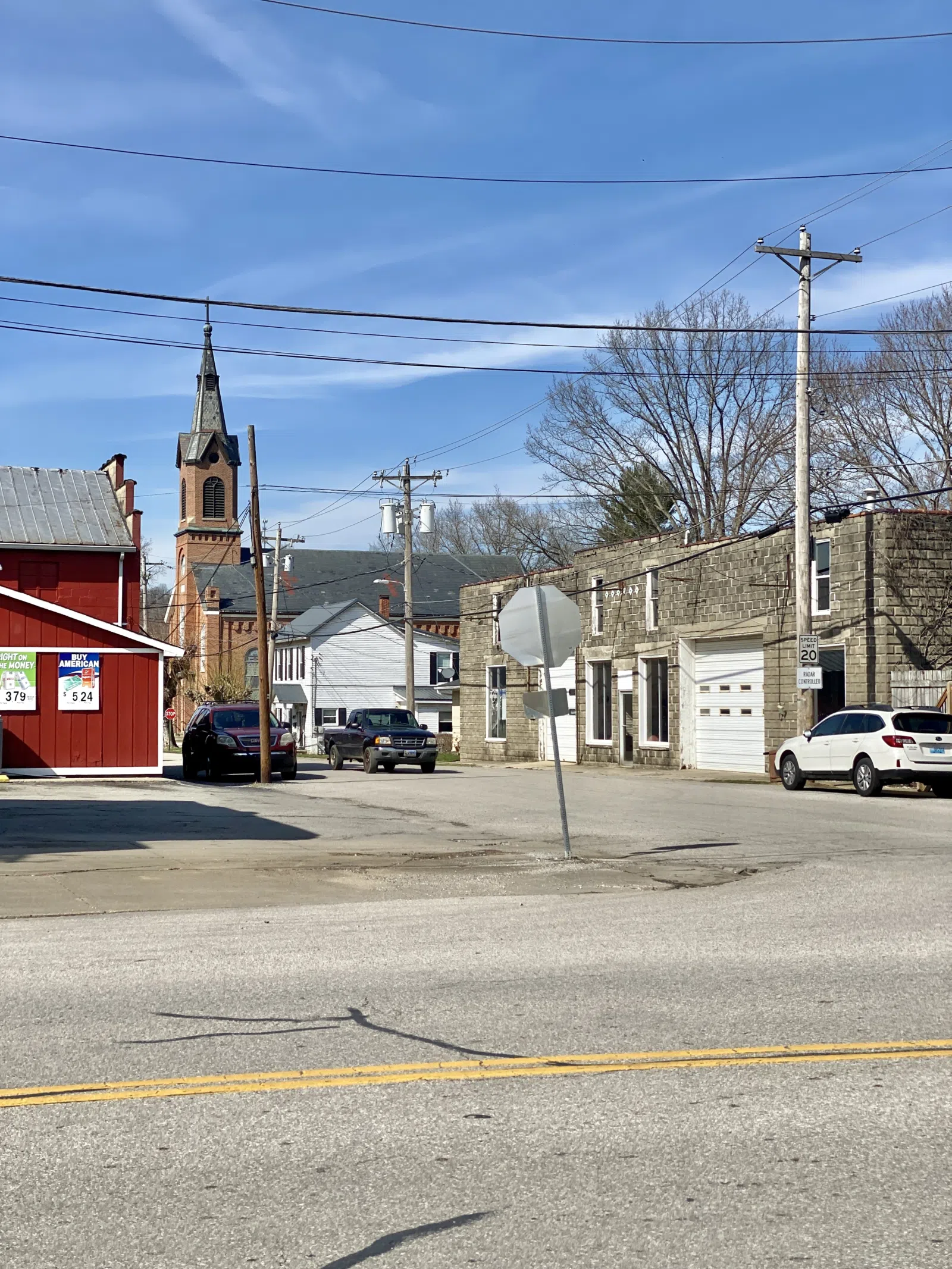 Built in the early 20th Century, this concrete block building was constructed to serve as an automotive repair garage, and features a parapet with a terra cotta cap, concrete lintels, large garage openings, and one-over-