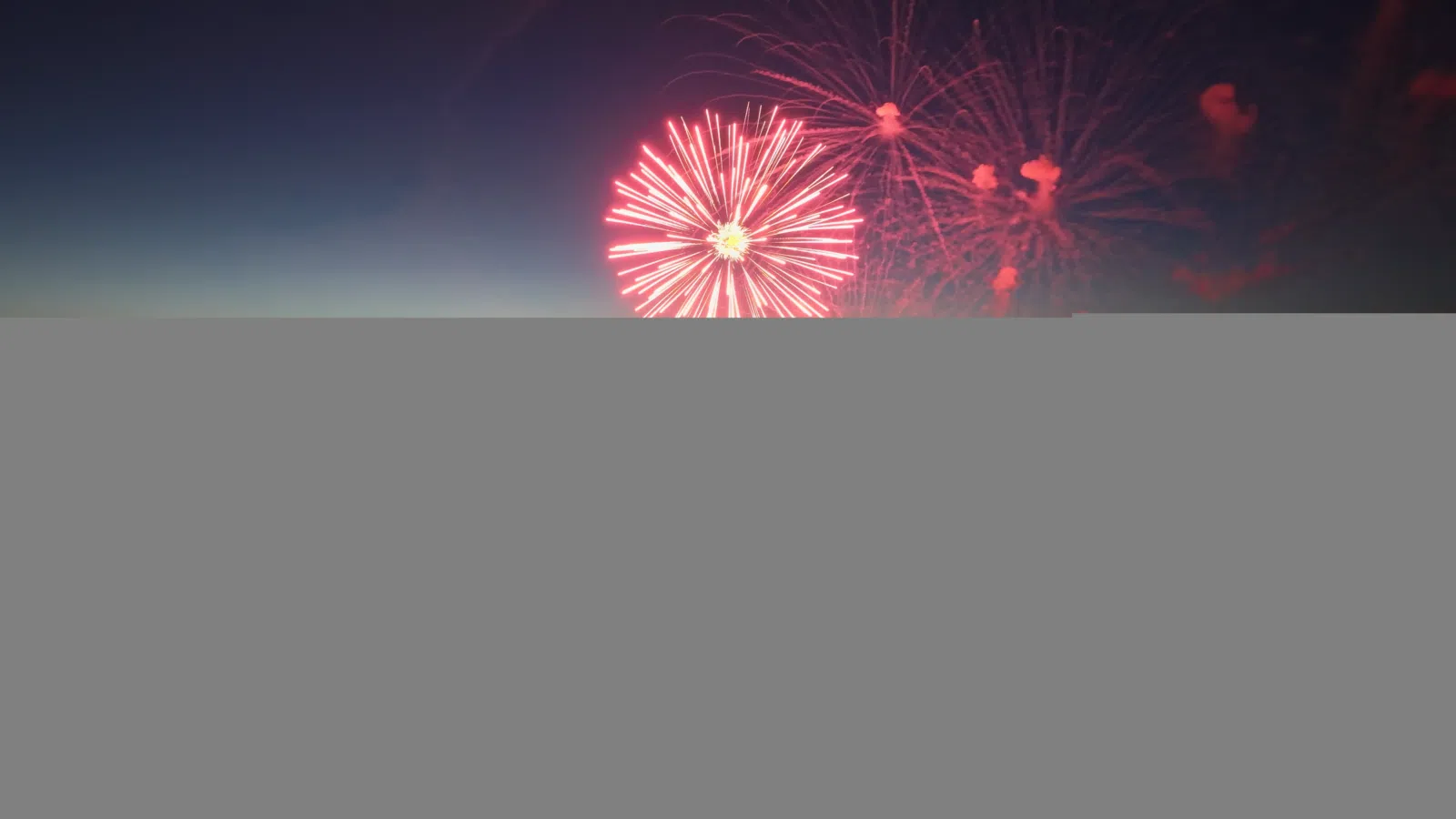 Aerial view of fireworks launched from Lake Santee dam Drone Shot taken by Airspace Cinema LLC