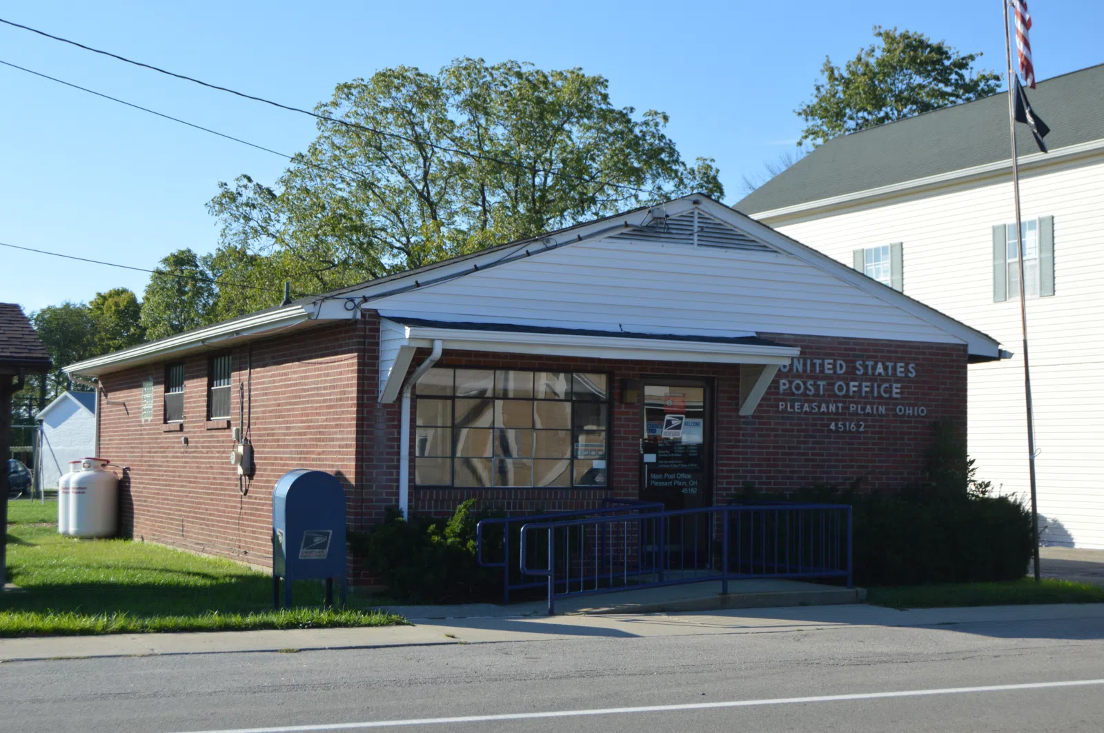 Front and southern side of the Pleasant Plain post office, located at 10069 Main Street (State Route 132) in Pleasant Plain, Ohio, United States.