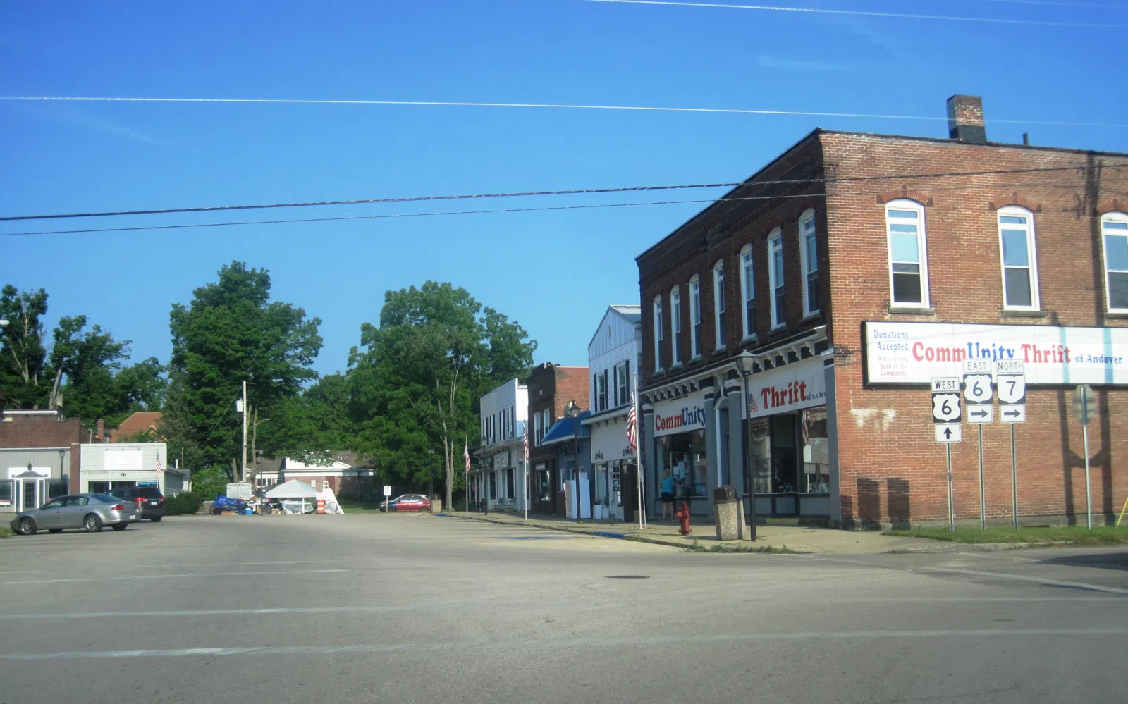 Photo of the Andover , Ohio public square looking west at North Main Street. The road around the public square carries U.S. Route 6 and Ohio State Route 7 .
