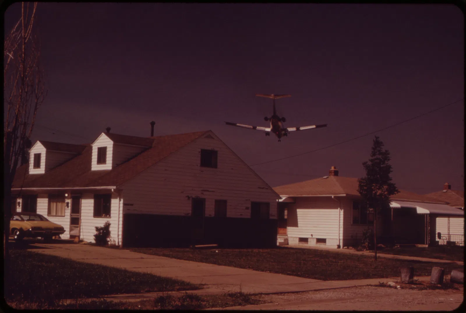 BROOK PARK HOMES ARE IN LANDING PATTERN OF HOPKINS AIRPORT JET PLANES - NARA - 550160.jpg