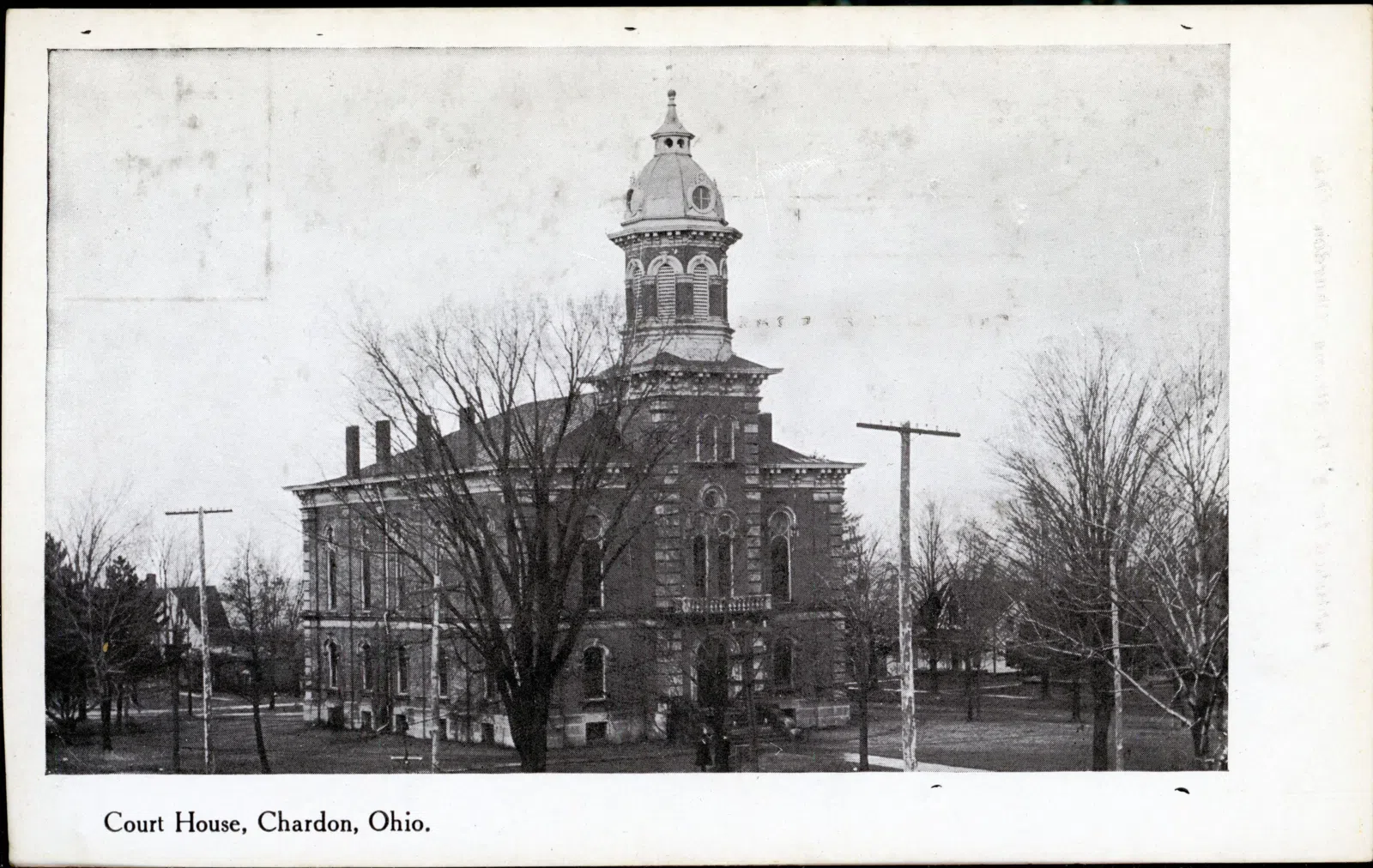 Black and white postcard of the courthouse in Chardon.