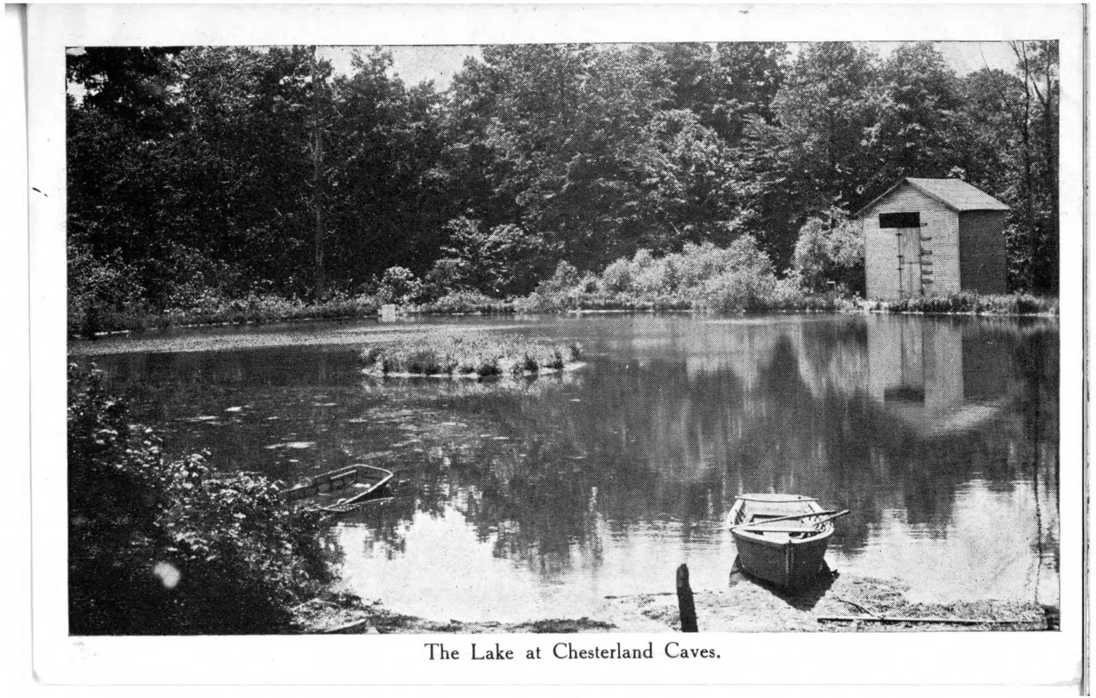Black and white postcard of the lake at Chesterland Caves in Chesterland.