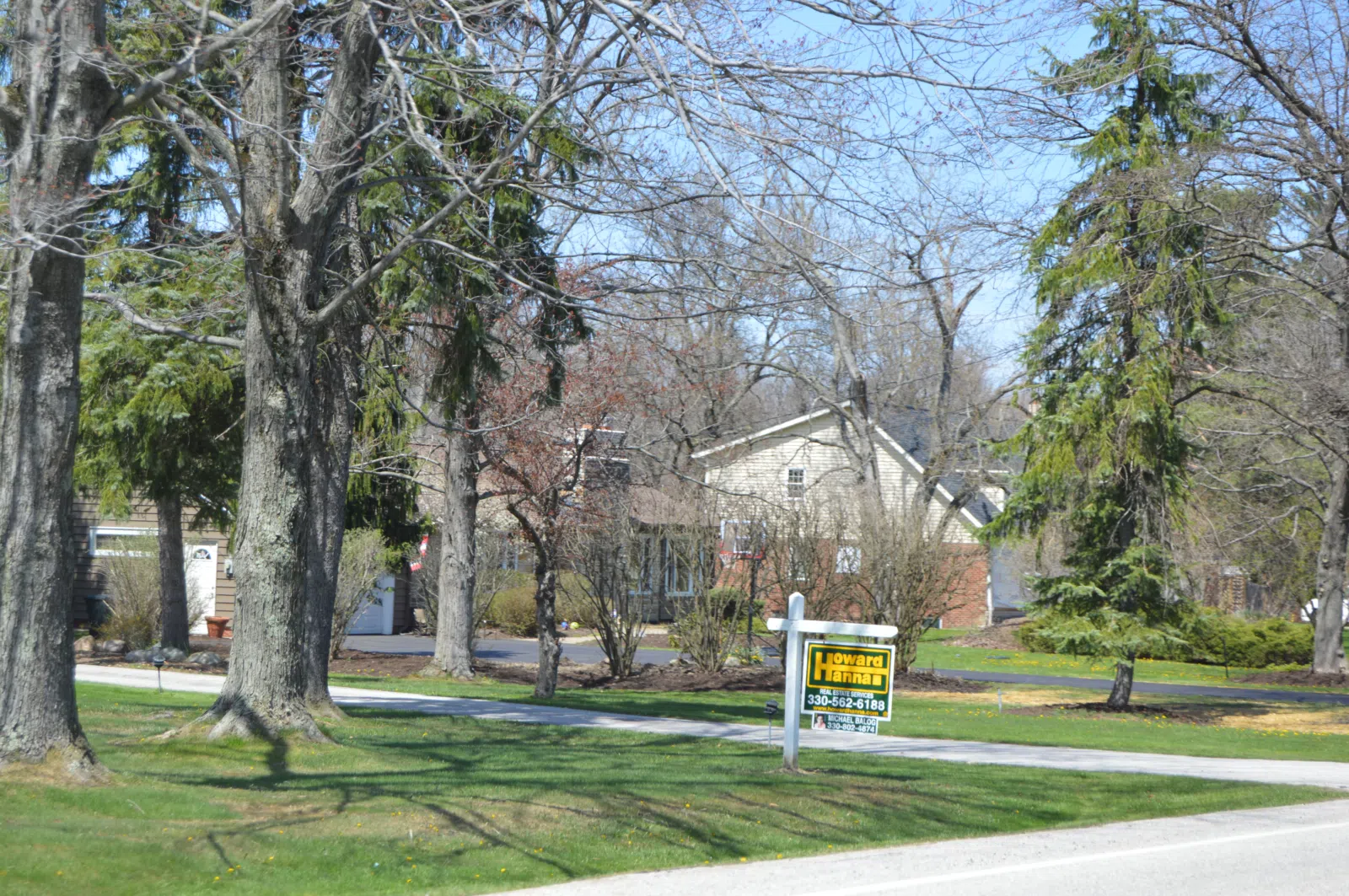 Houses on the western side of Brainard Road south of Harvard Road in Orange , Ohio , United States .