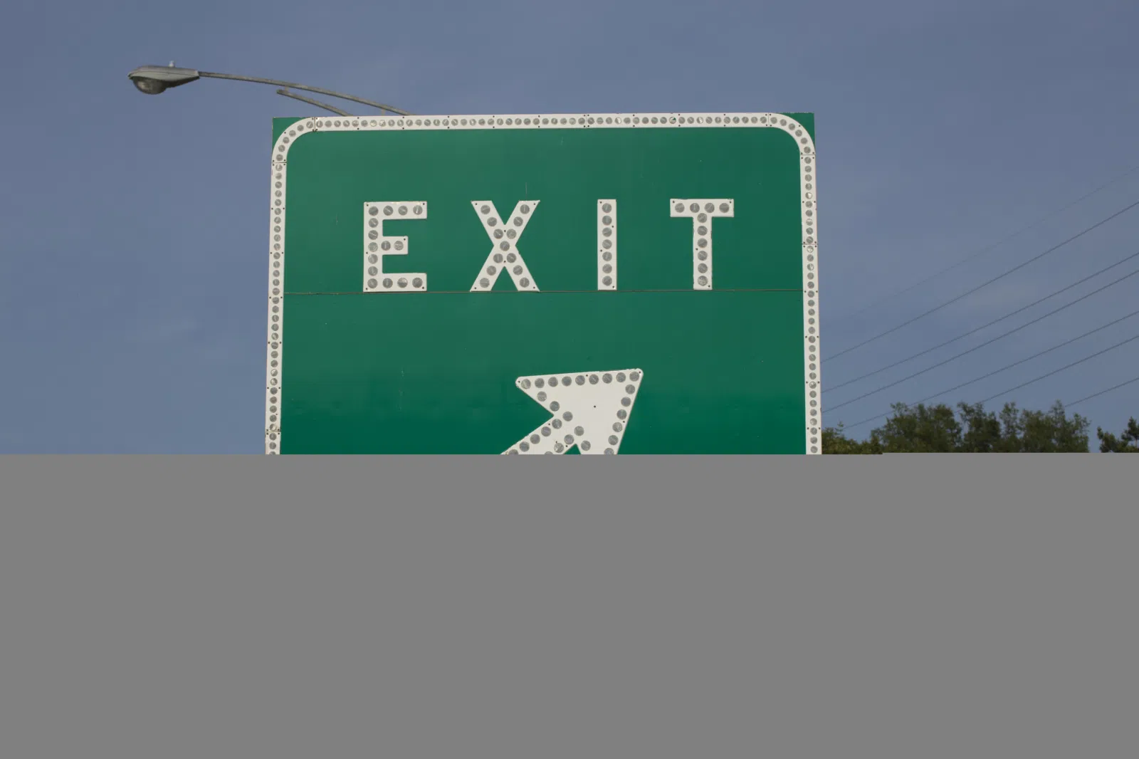 A button copy E5-1 'Exit Gore' traffic sign, in Rocky River, Ohio .