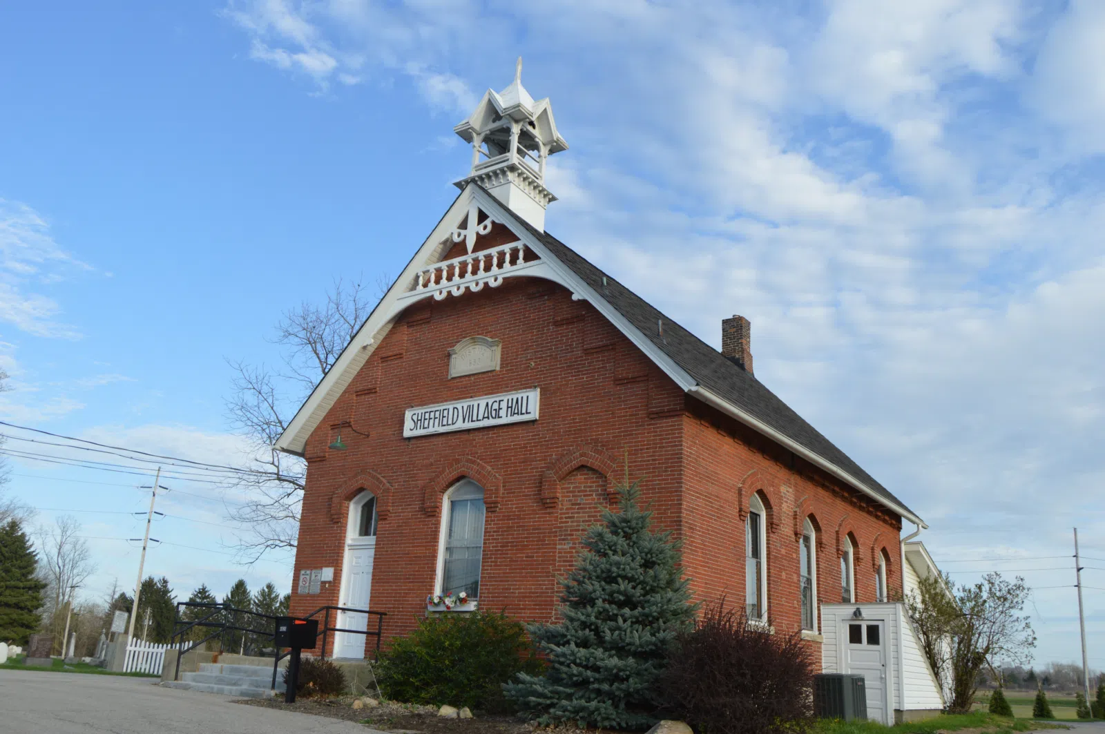 Front and western side of the Sheffield Village Hall , located at 4820 Detroit Road ( State Route 254 ) in Sheffield , Ohio , United States . Built in 1883 as a…