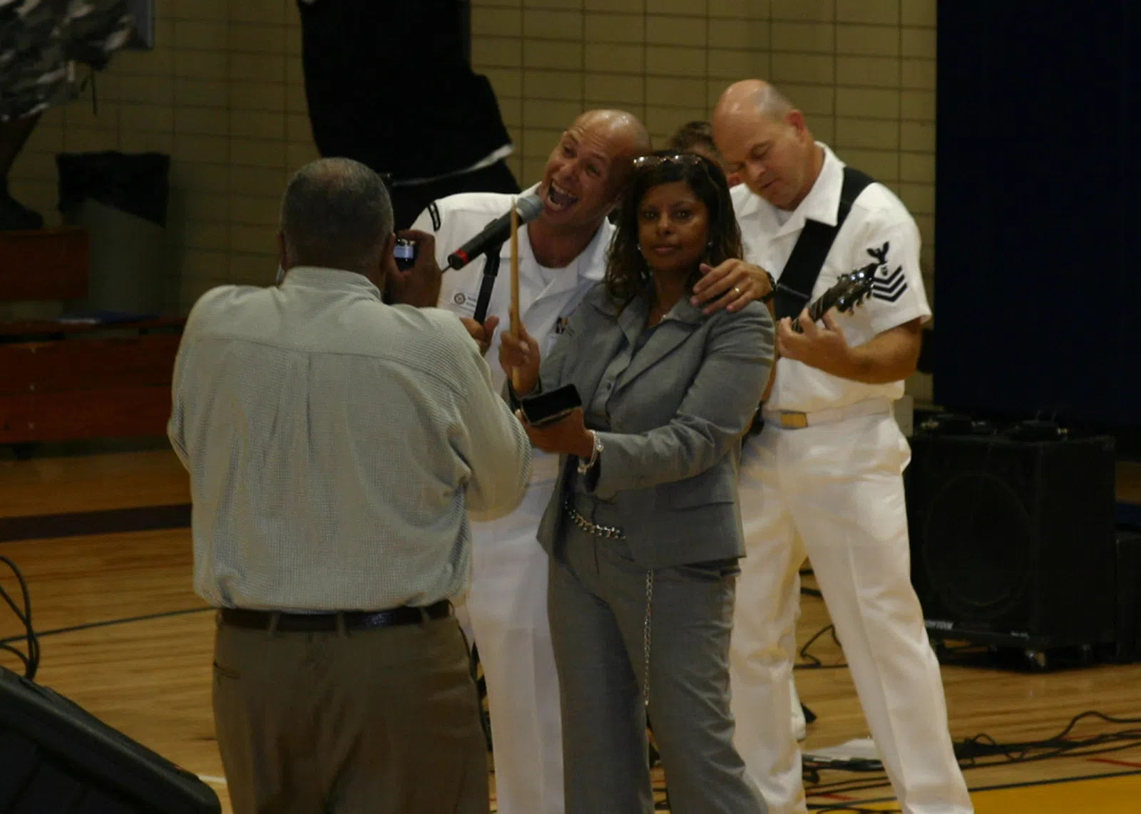 Cleveland, Ohio (Aug. 30, 2006) - Musician 3rd Class Spencer Hassenritter assigned to Navy Band Mid-South rock band "Freedom" mugs for the camera while performing…