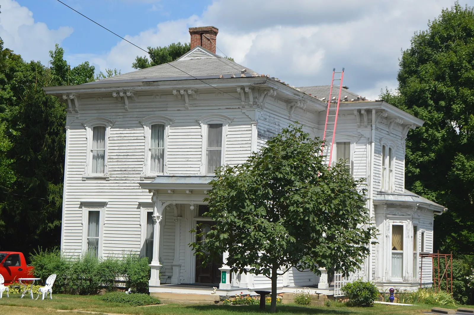 Front and southern side of the house located at 28 N. Main Street in Hartford, Ohio, United States.