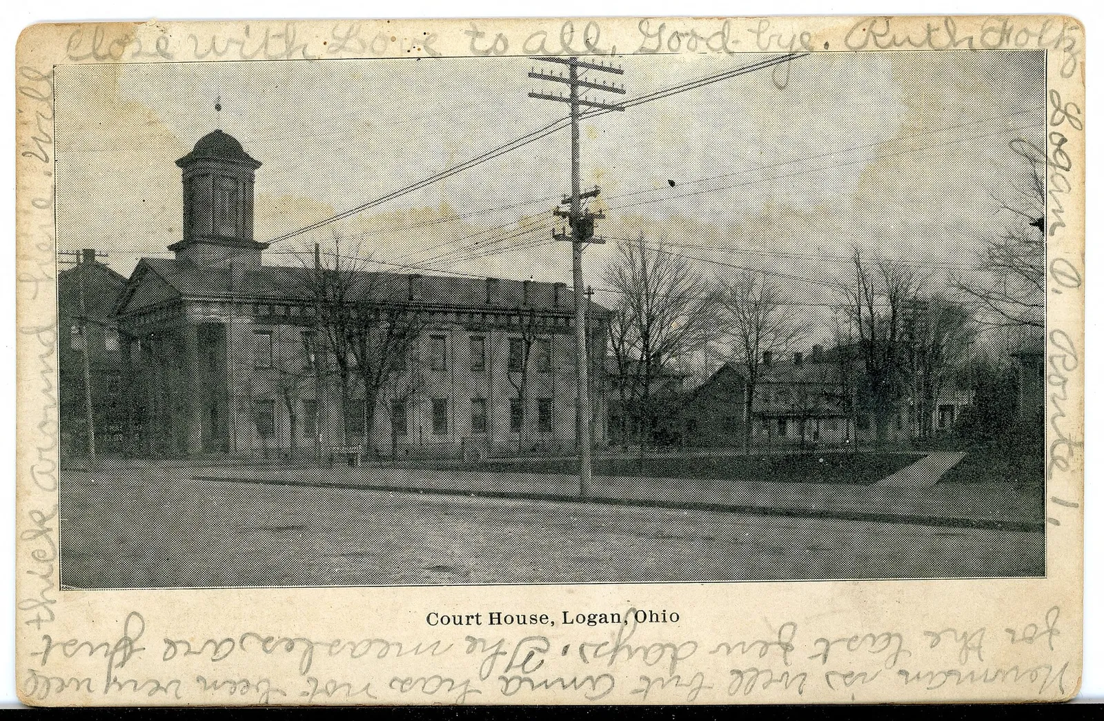 Black and white postcard of the Court House in Logan, Ohio.