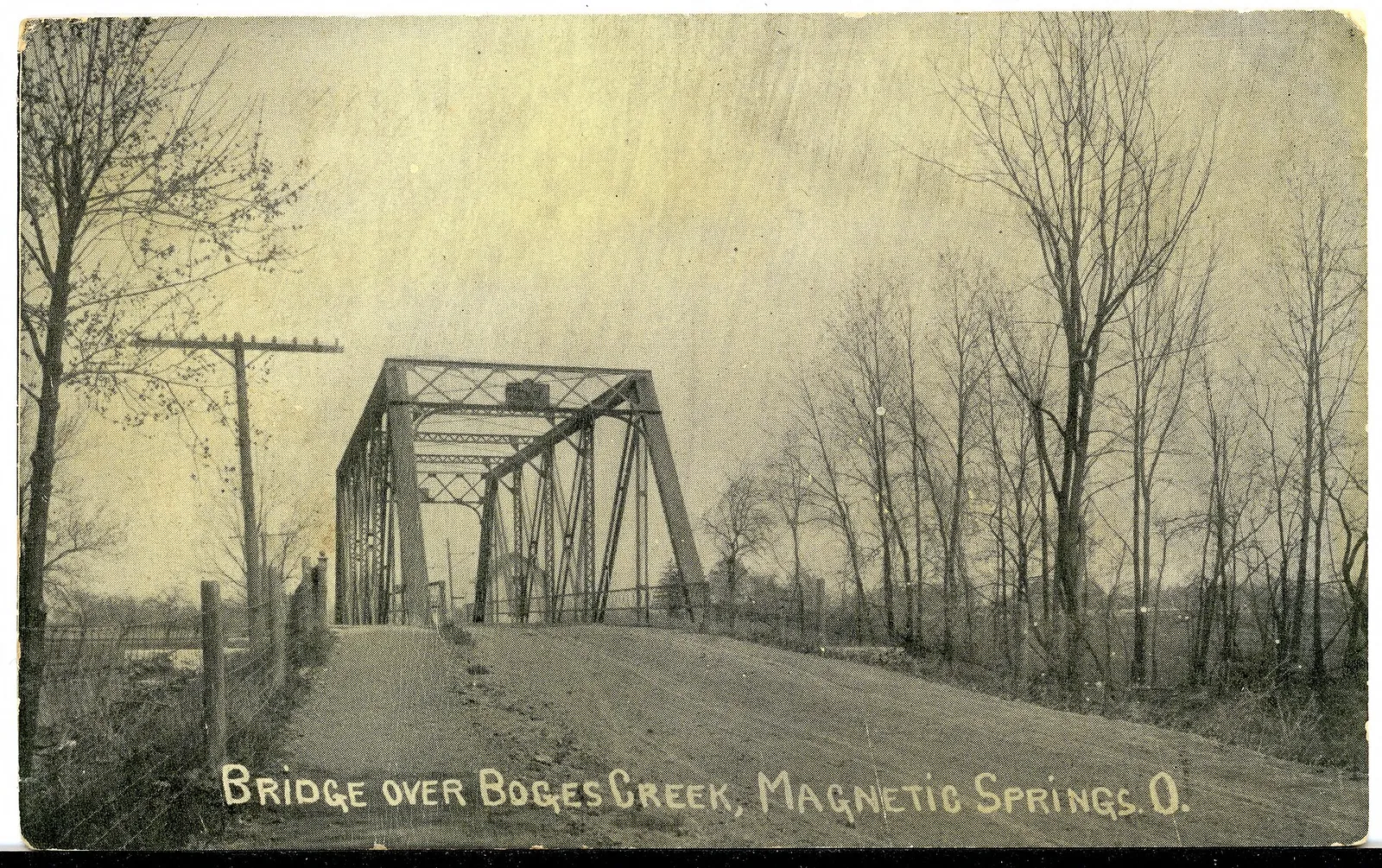 Black and white postcard of the bridge over Boges Creek in Magnetic Springs.