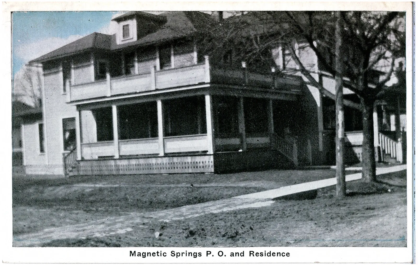 Black and white photo of clapboard building with post office and residence in Magnetic Springs, Ohio.